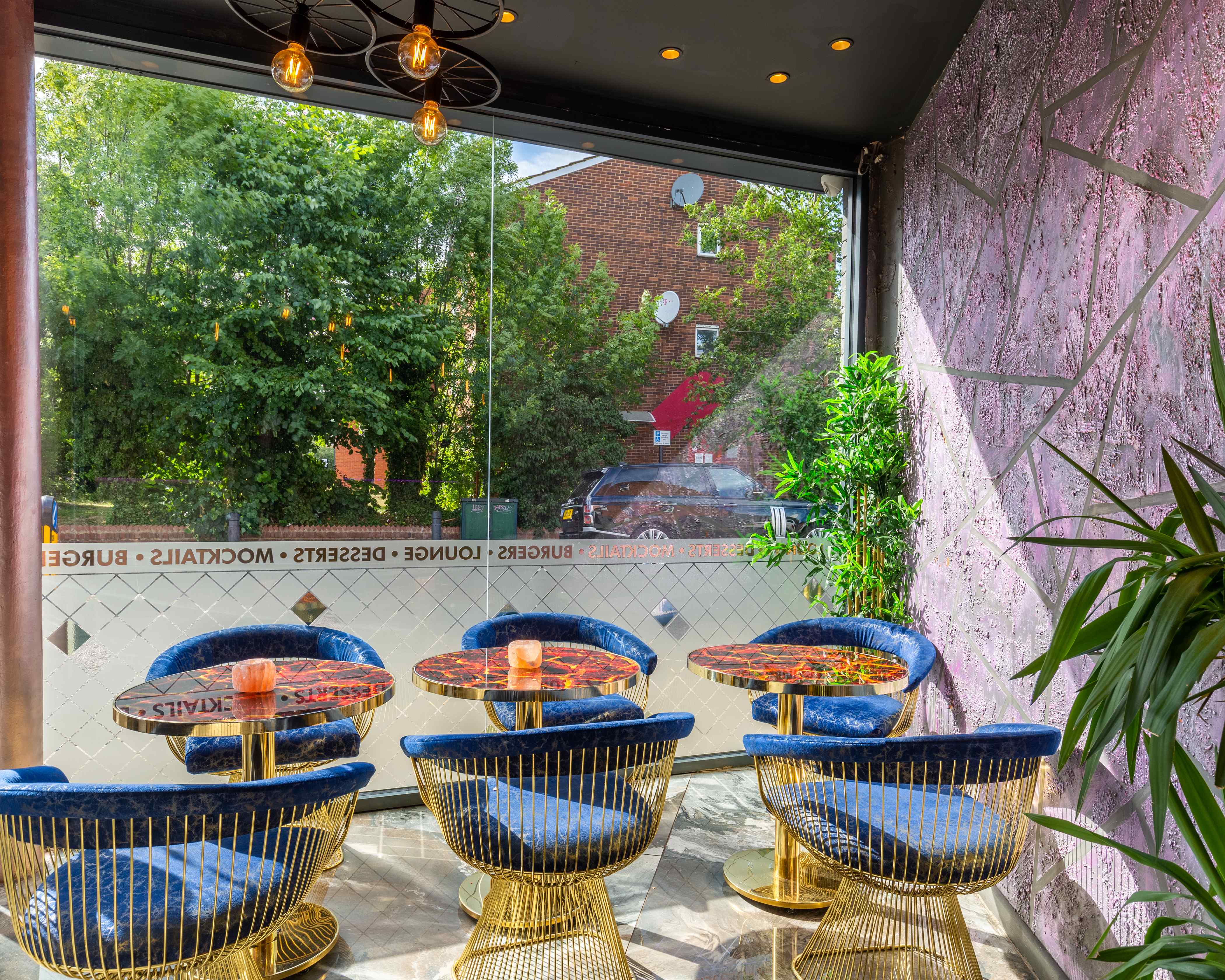 Stylish meeting space with blue seating, ideal for networking events and gatherings.