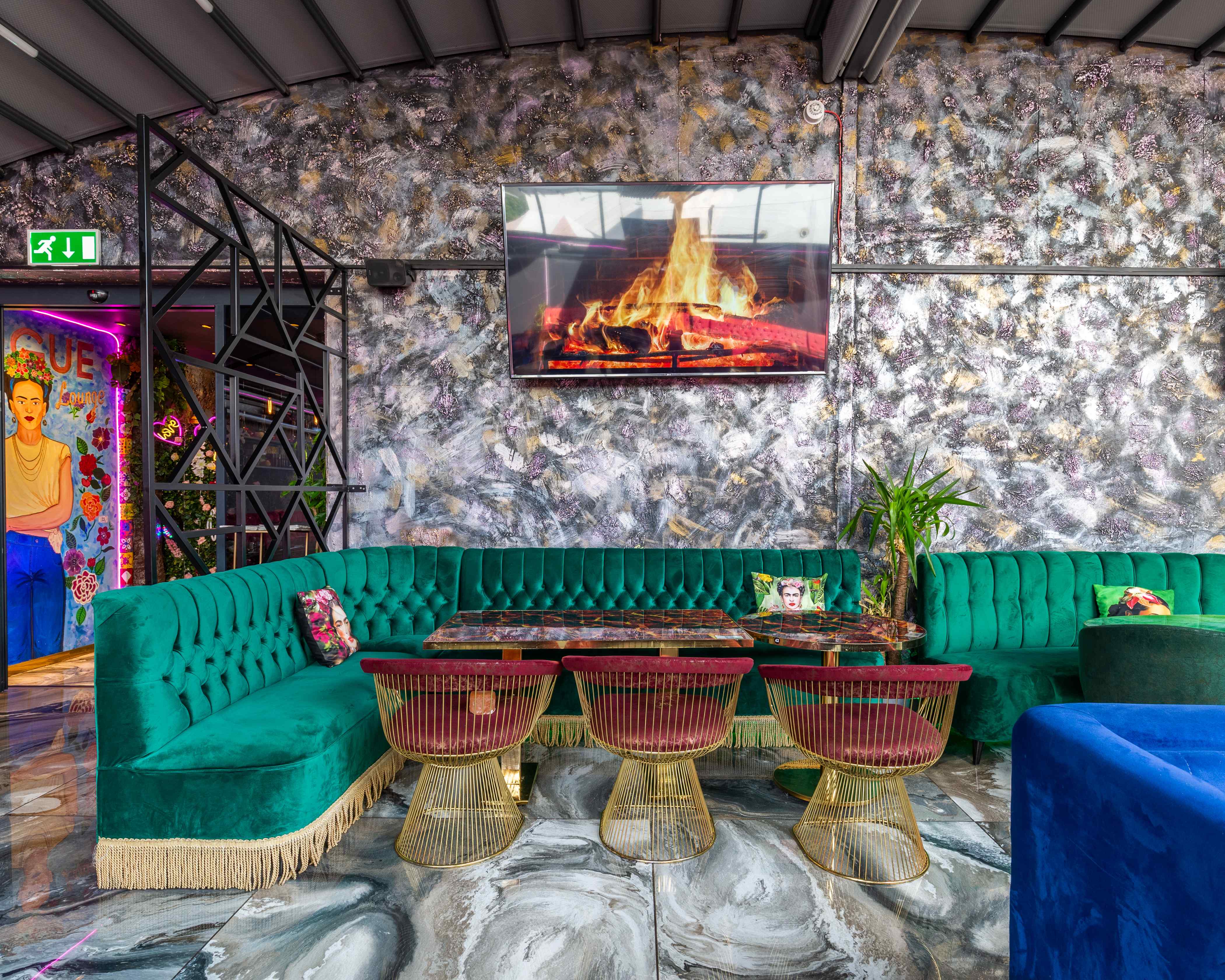 Vogue Lounge event space with plush green seating and modern decor for gatherings.