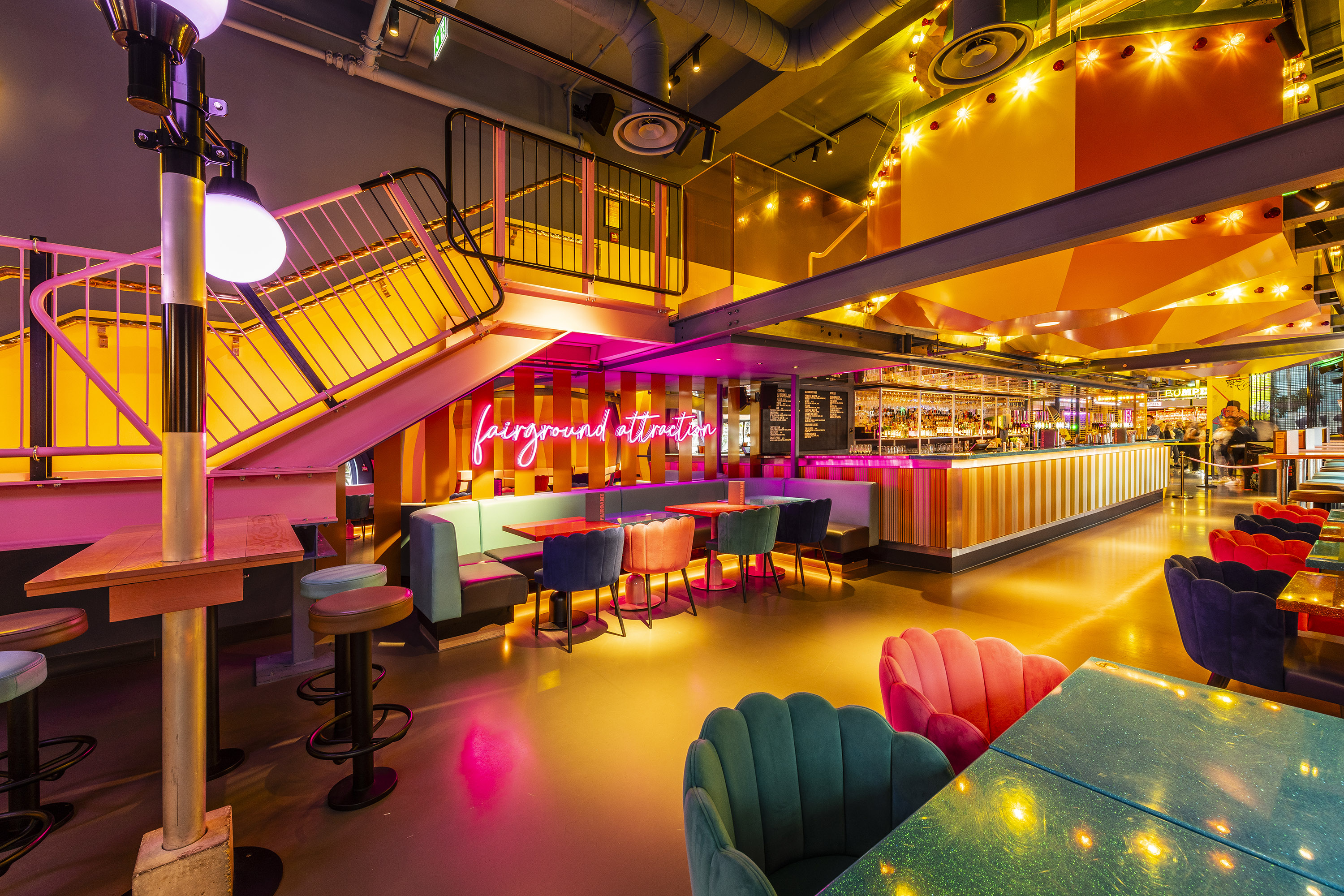 Vibrant venue with colorful seating for exclusive events and gatherings in Fairgame.