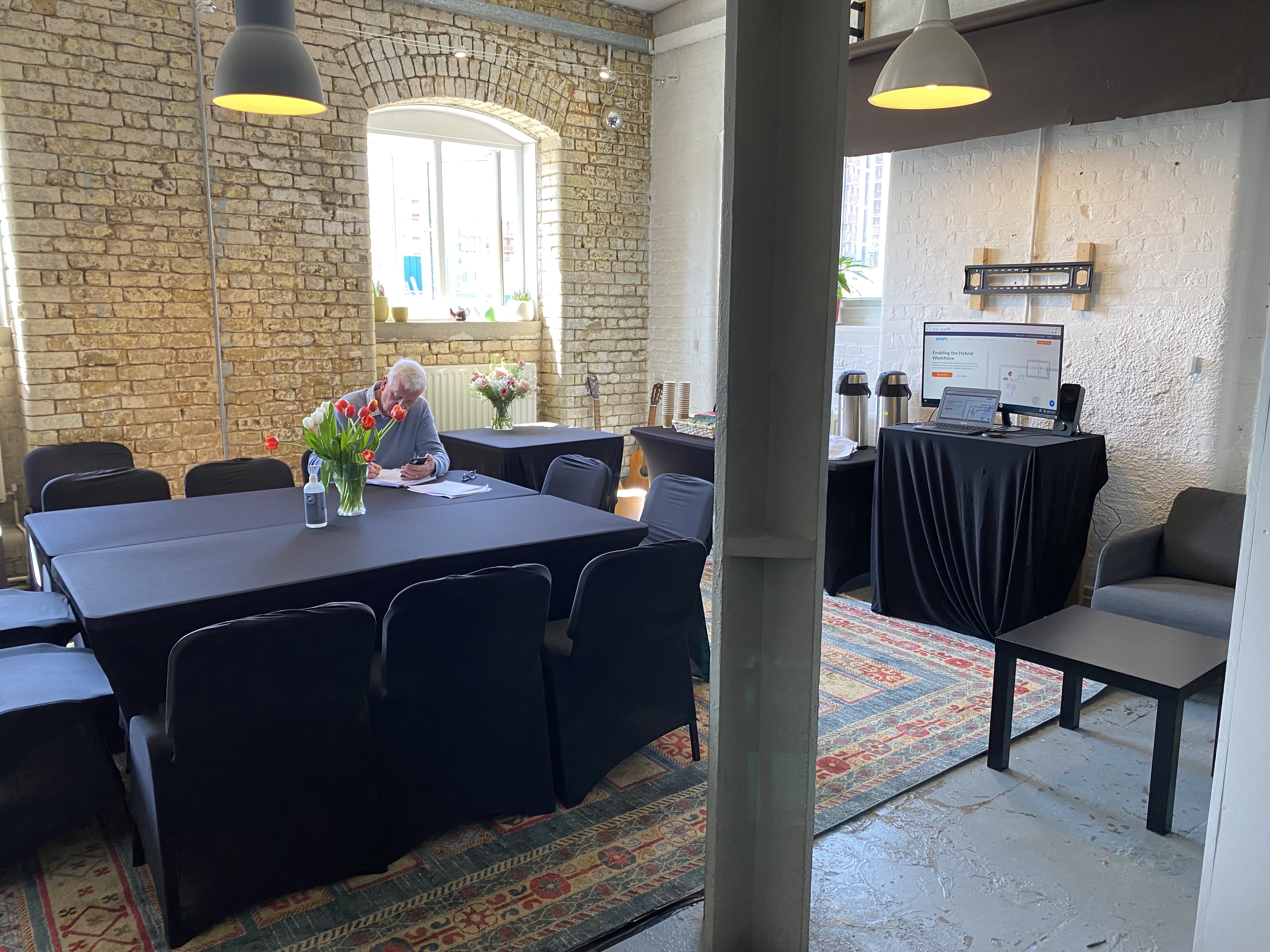 Randells Room at The Boathouse Studios, featuring a long table and natural light for meetings.