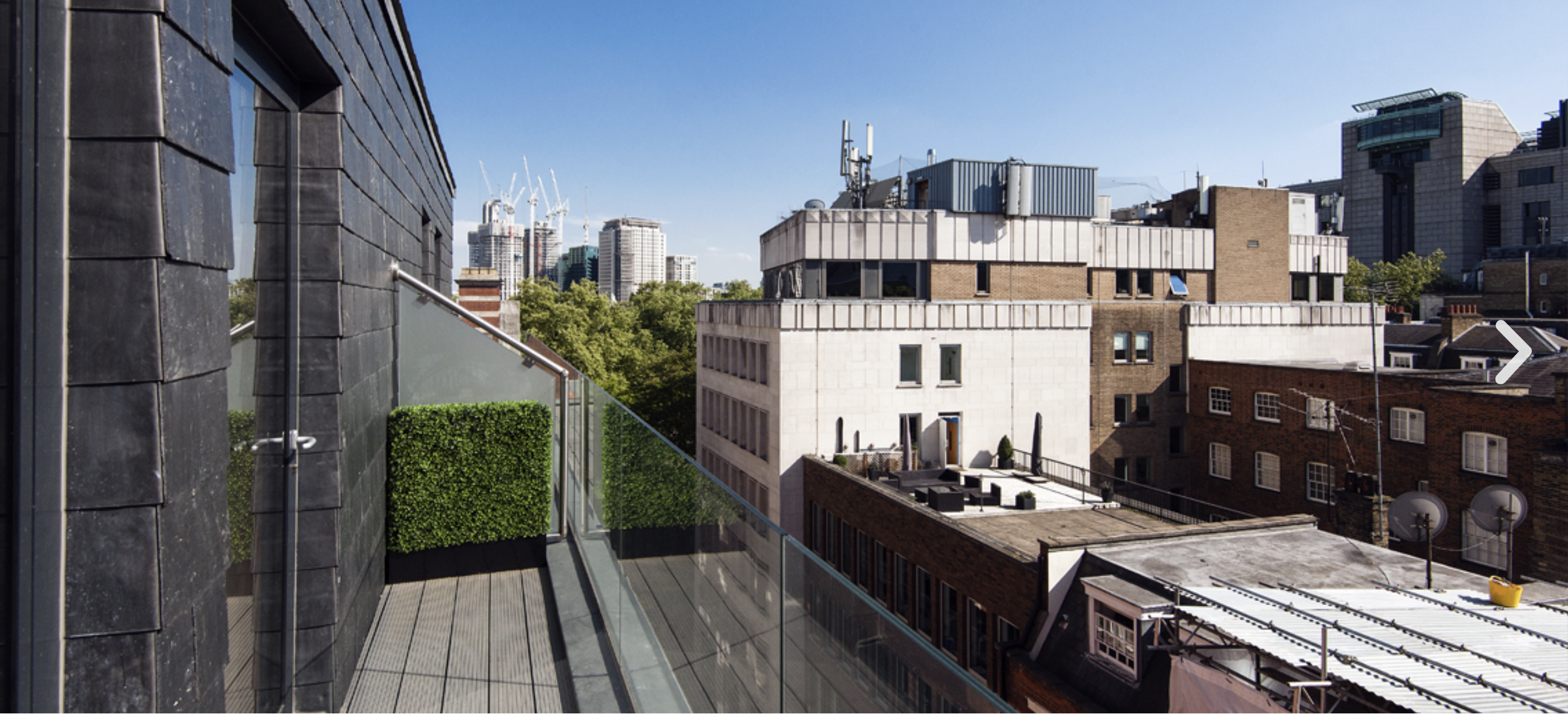 Modern rooftop terrace at Luxury apartment Charing Cross for outdoor events and gatherings.