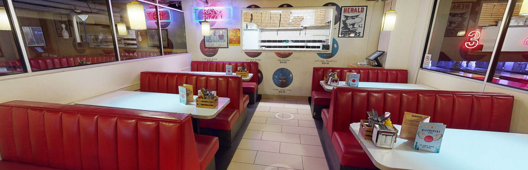 Vibrant diner with red booths in Bloomsbury Bowling Lanes for casual events and meetings.