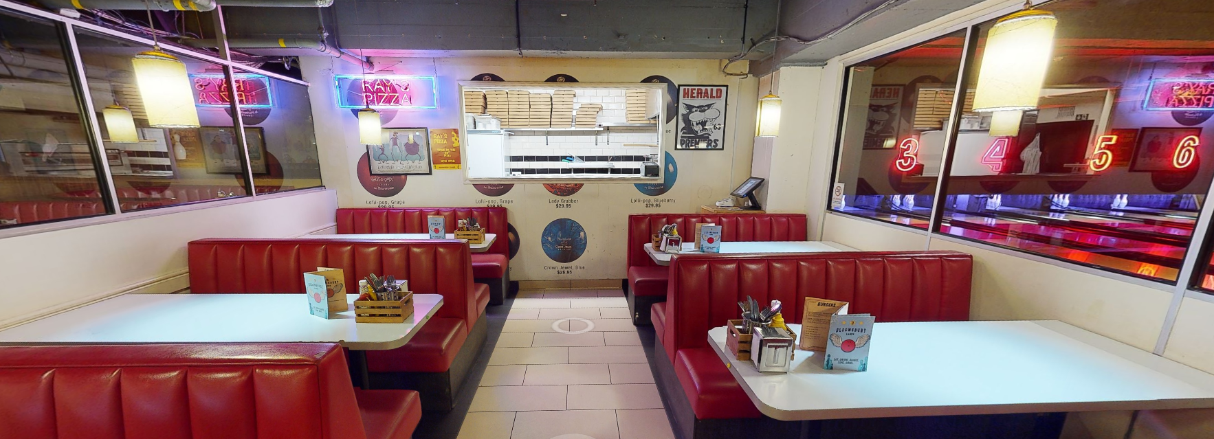 Vibrant diner with red vinyl booths, perfect for casual meetings and events.
