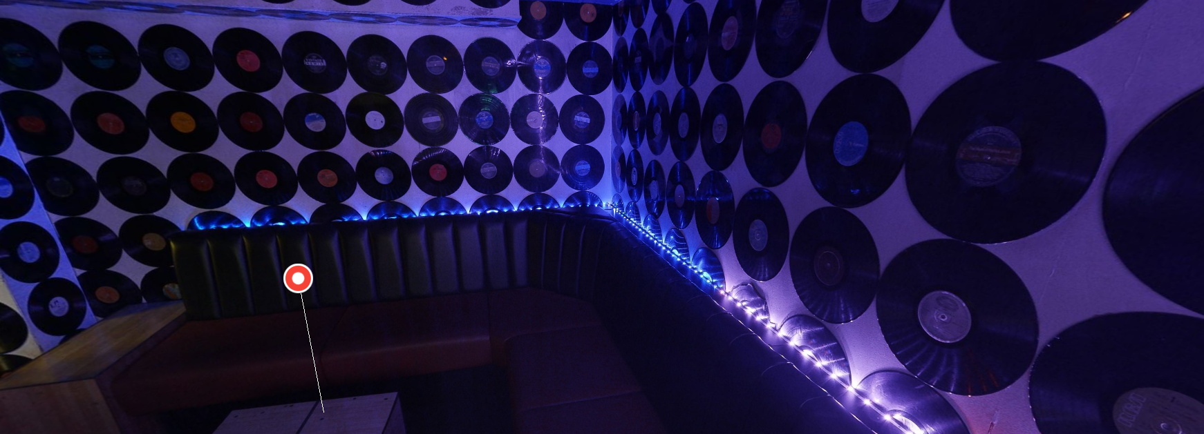 Retro event space with vinyl records, ideal for intimate gatherings and themed parties.