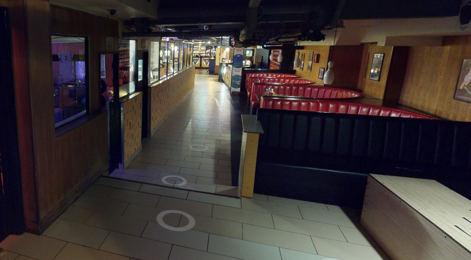 Spacious Bloomsbury Bowling Lanes venue with warm lighting for events and gatherings.