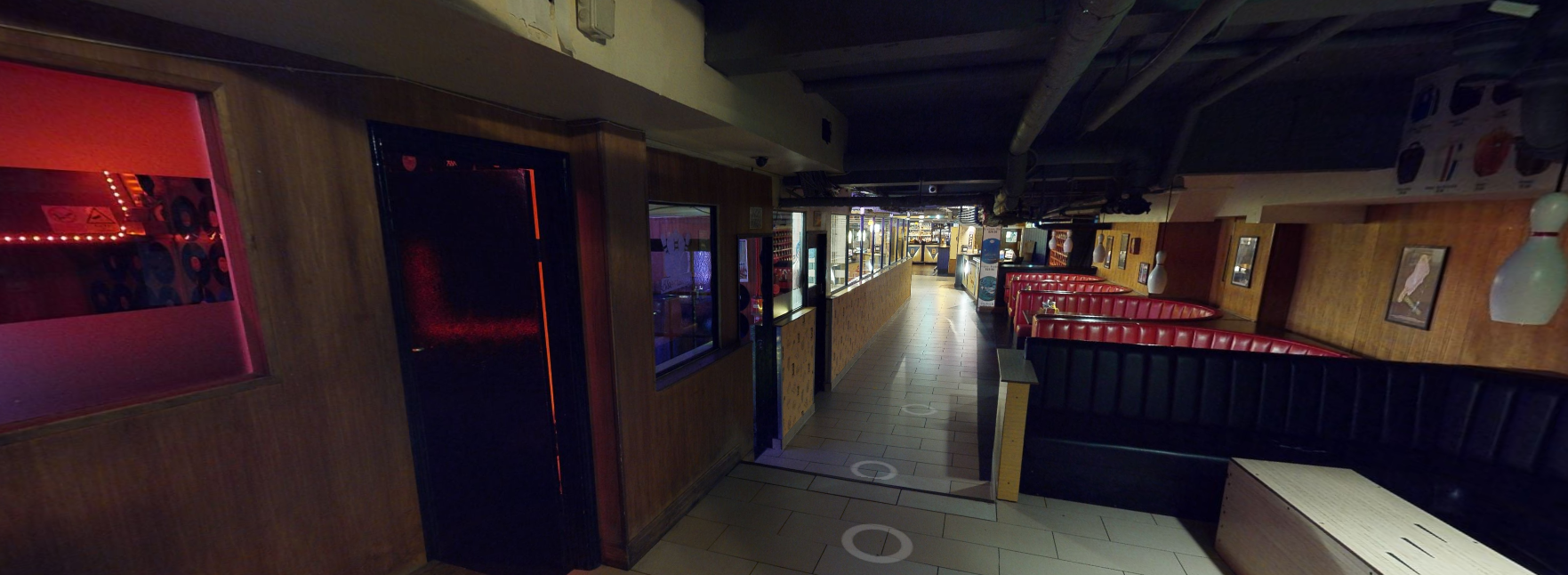 Spacious event venue with warm lighting and flexible seating in Bloomsbury Bowling Lanes.