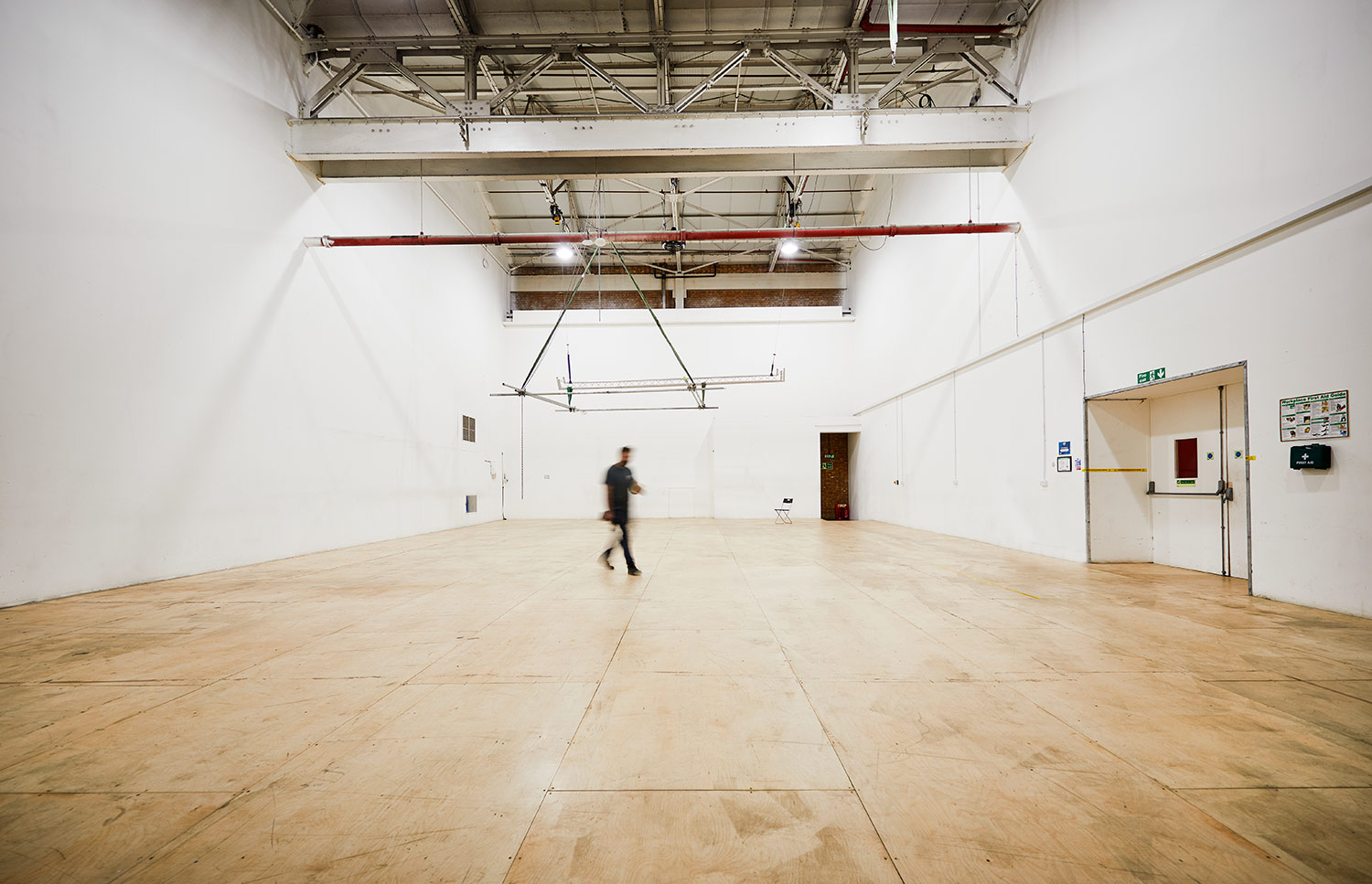 Spacious event space with high ceilings at Sugar Studios for corporate meetings and workshops.
