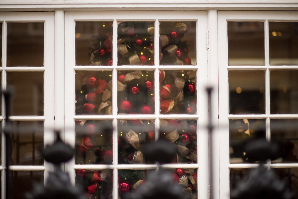 Christmas tree with warm lights at Victory Services Club, perfect for holiday events.