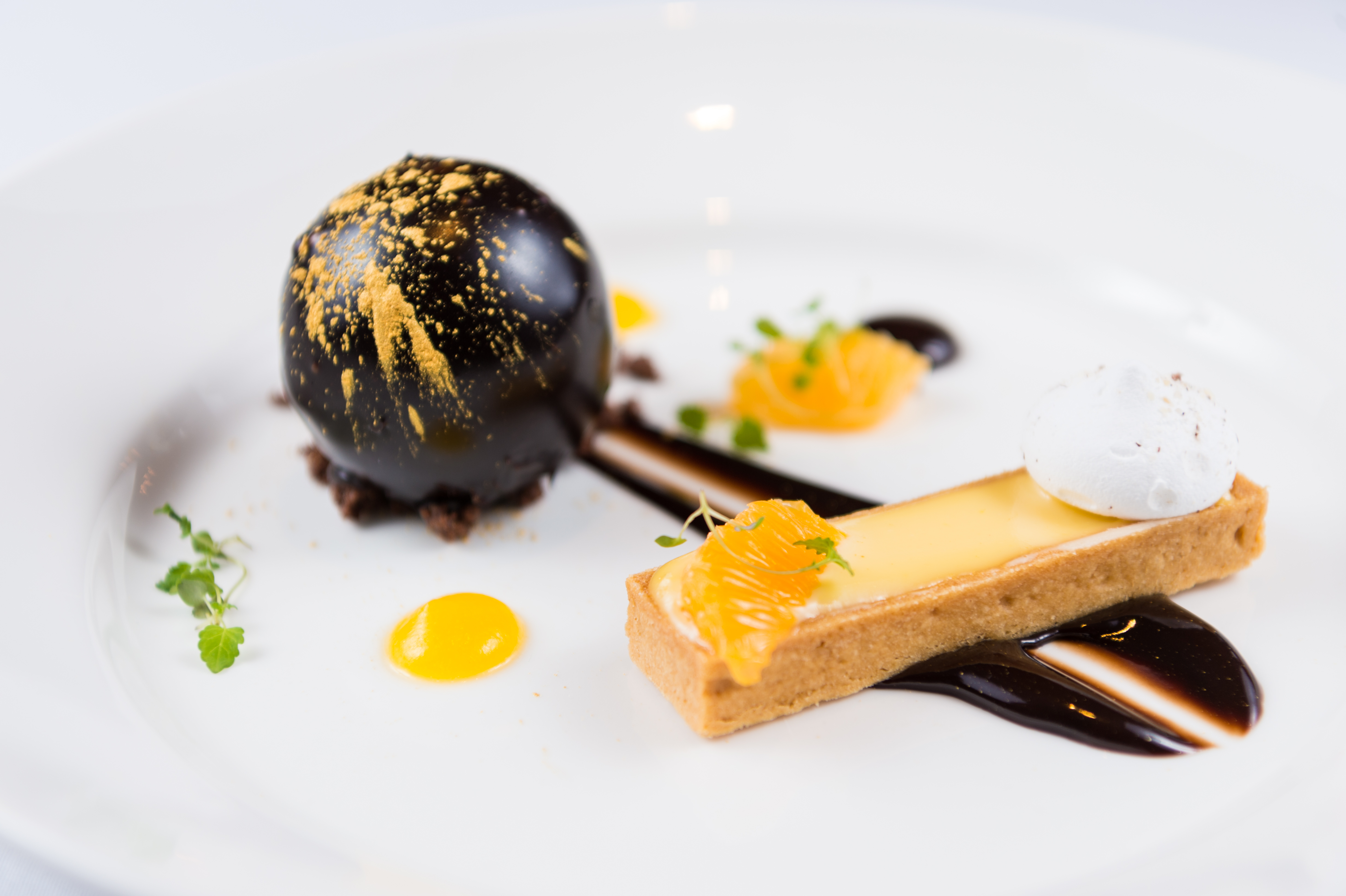 Elegant chocolate sphere dessert at Victory Services Club Christmas event.