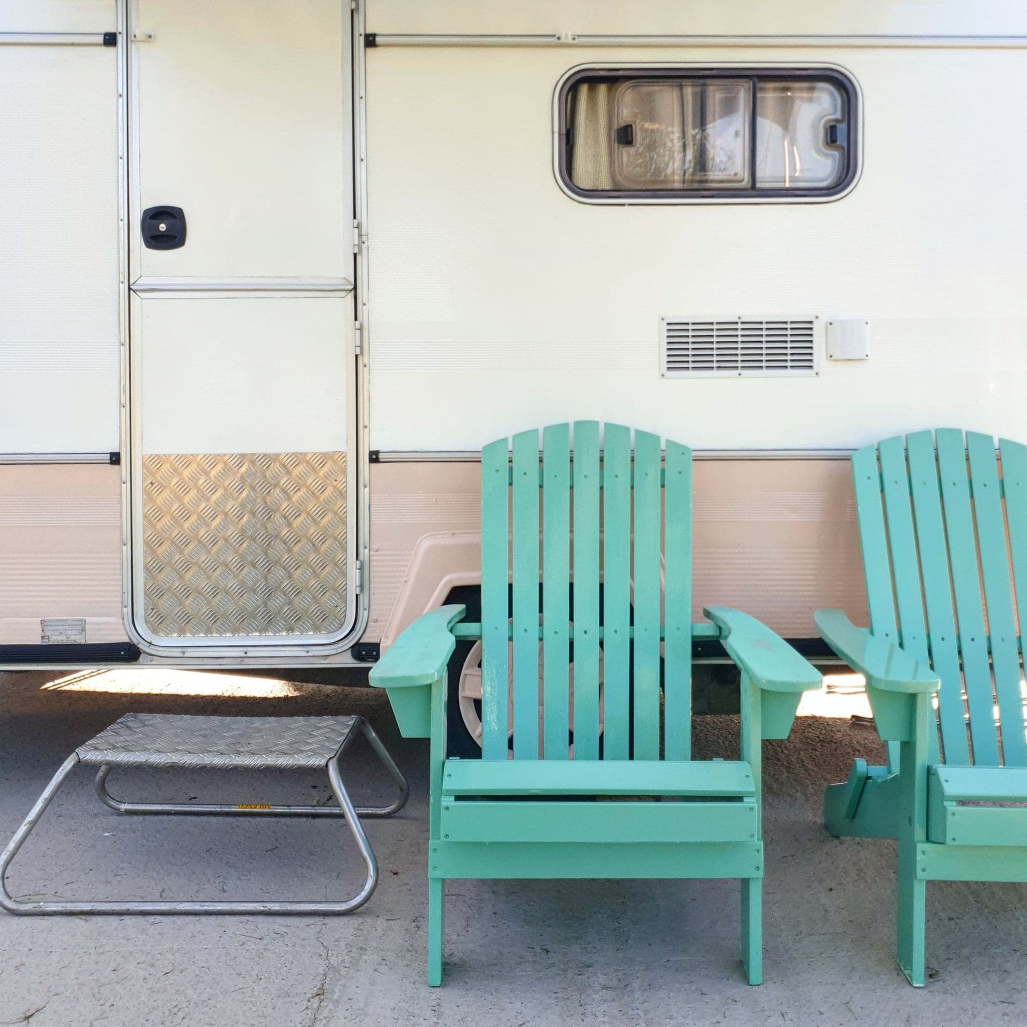 Cozy outdoor setup with turquoise Adirondack chairs for networking events.