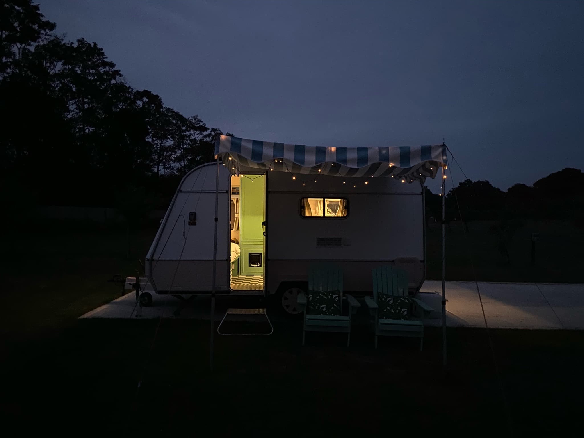Vintage caravan with soft lights for outdoor events and intimate gatherings.