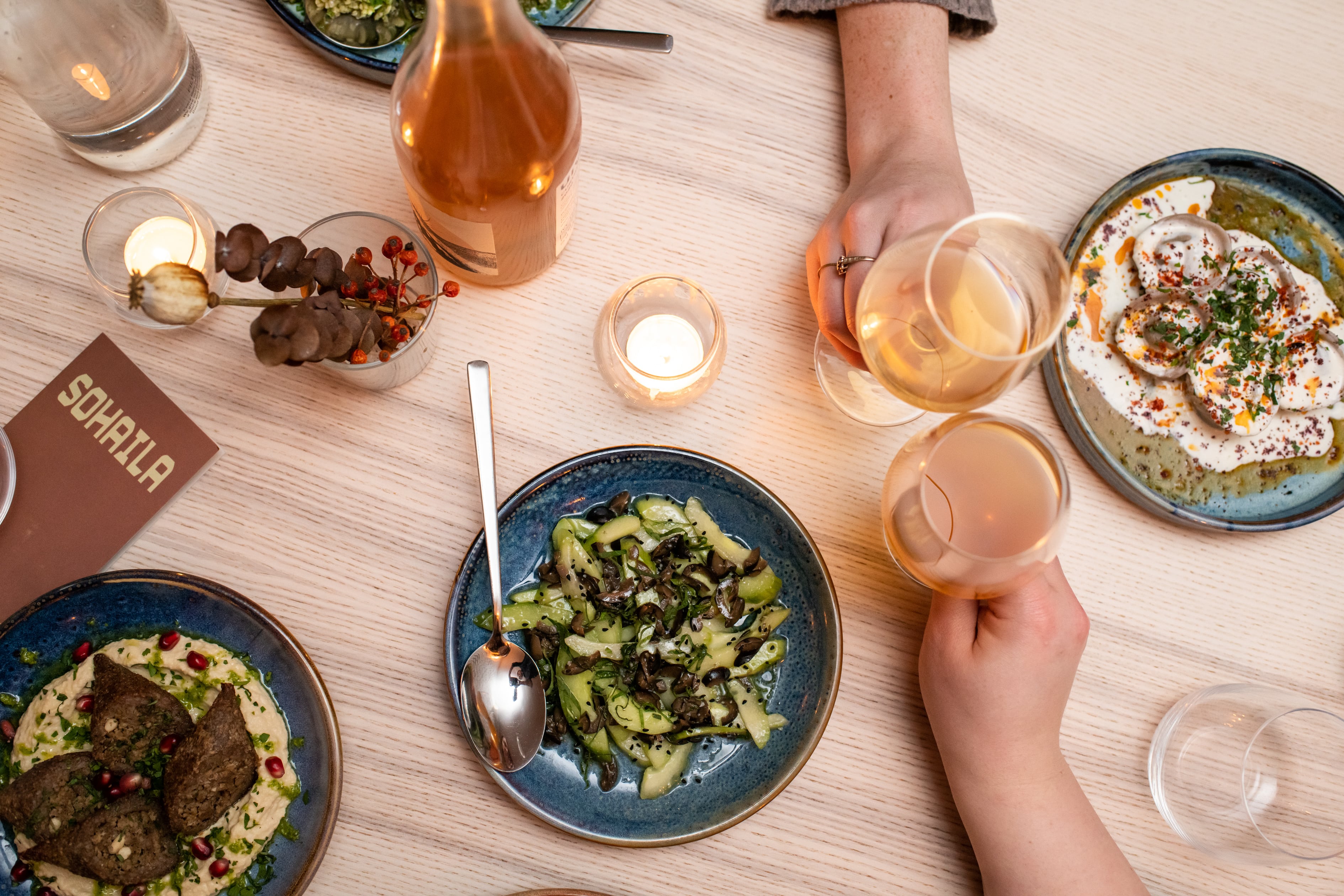 Elegant dining table setup with vibrant dishes for networking event or intimate gathering.