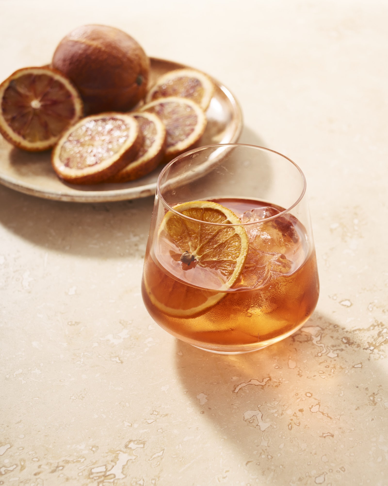 Elegant cocktail with dried orange slices, perfect for upscale events and networking.