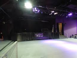 Versatile event space at The Venue Carlisle with stage, ideal for presentations and performances.