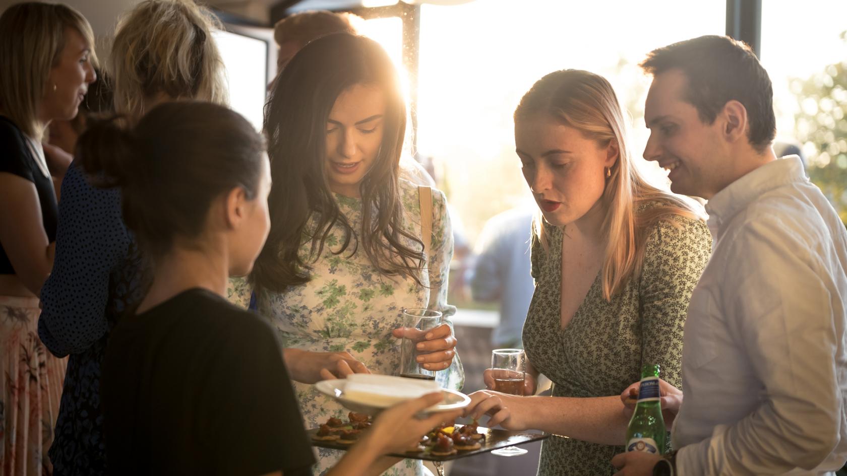 Christmas networking event at Wallacespace Spitalfields with warm lighting and social interactions.