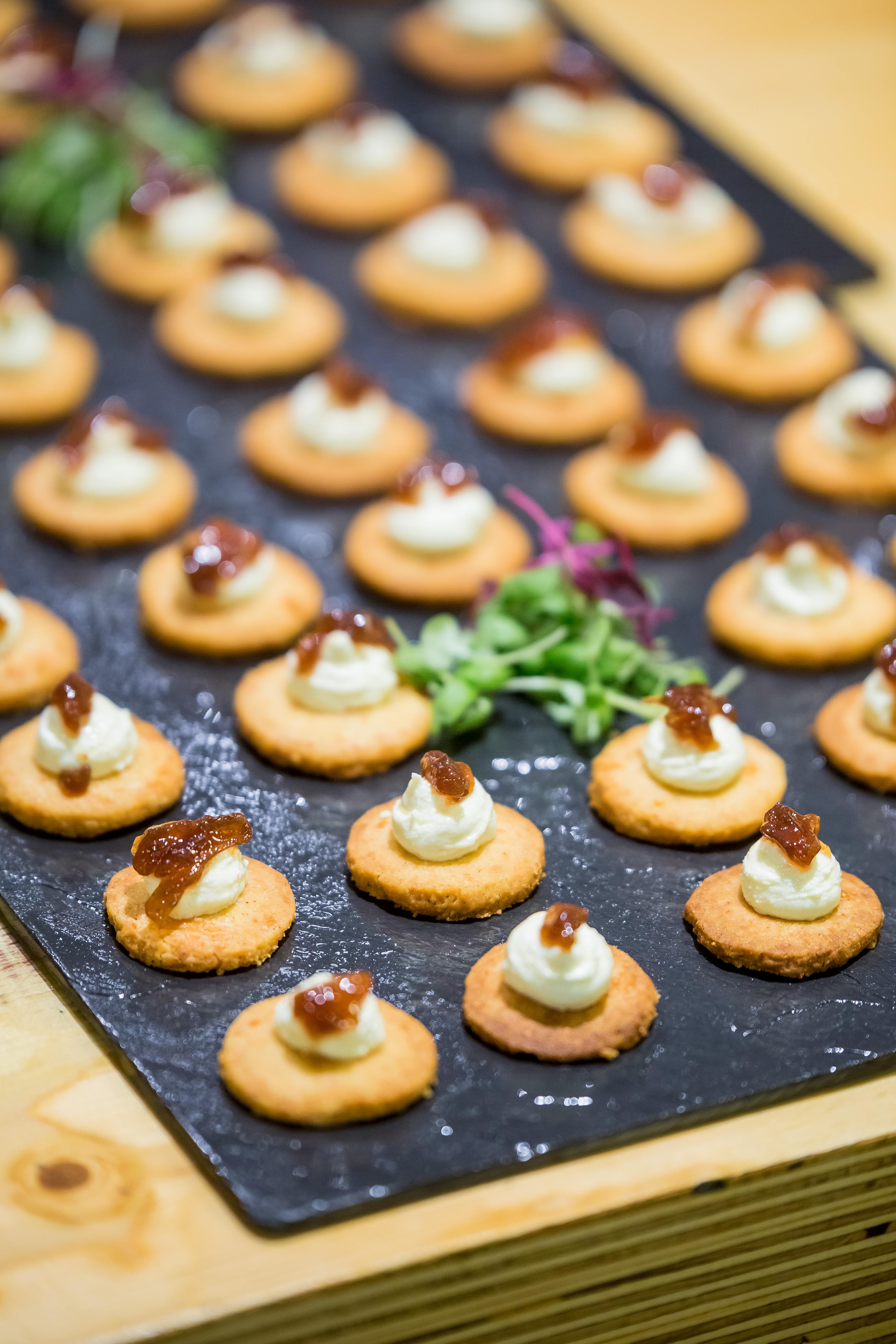 Elegant canapés on slate platter at Wallacespace Spitalfields Christmas celebration.