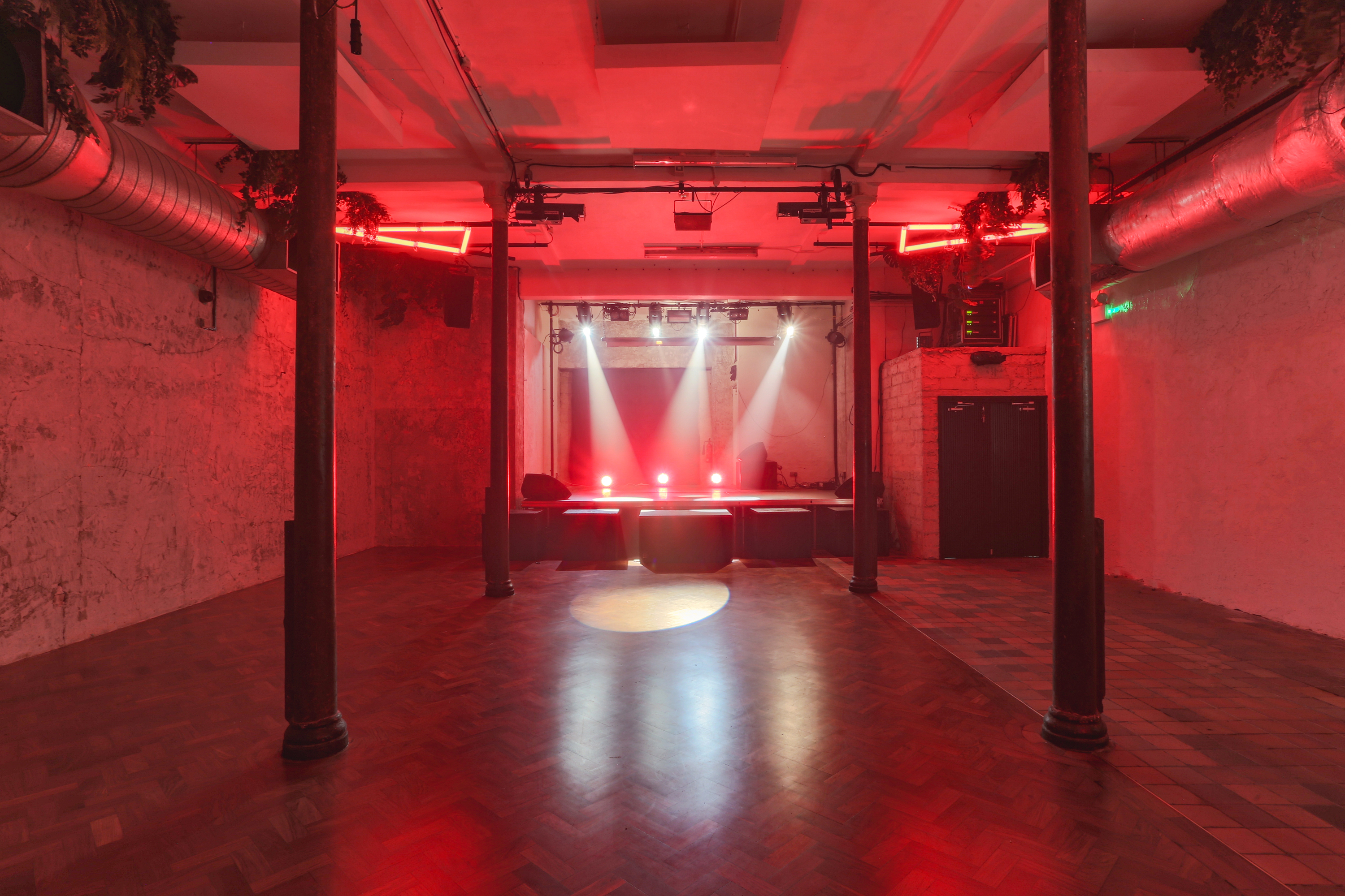 Live Room at 93 Feet East: industrial event space with exposed brick, ideal for concerts and parties.