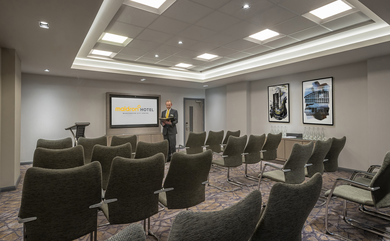 Modern meeting room at Maldron Hotel Manchester, ideal for corporate events and workshops.