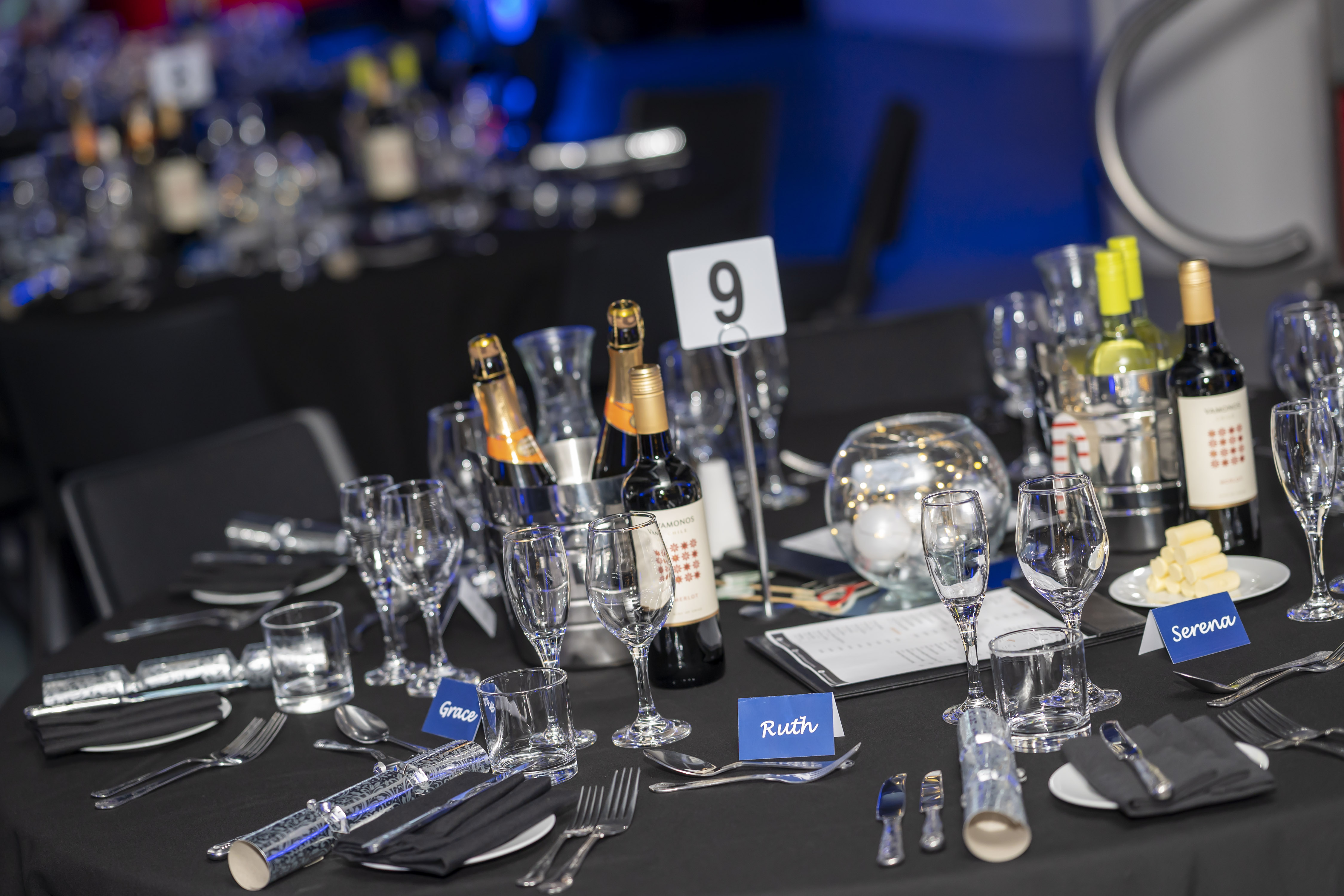 Elegant Christmas banquet table at Millennium Point with champagne centerpieces.