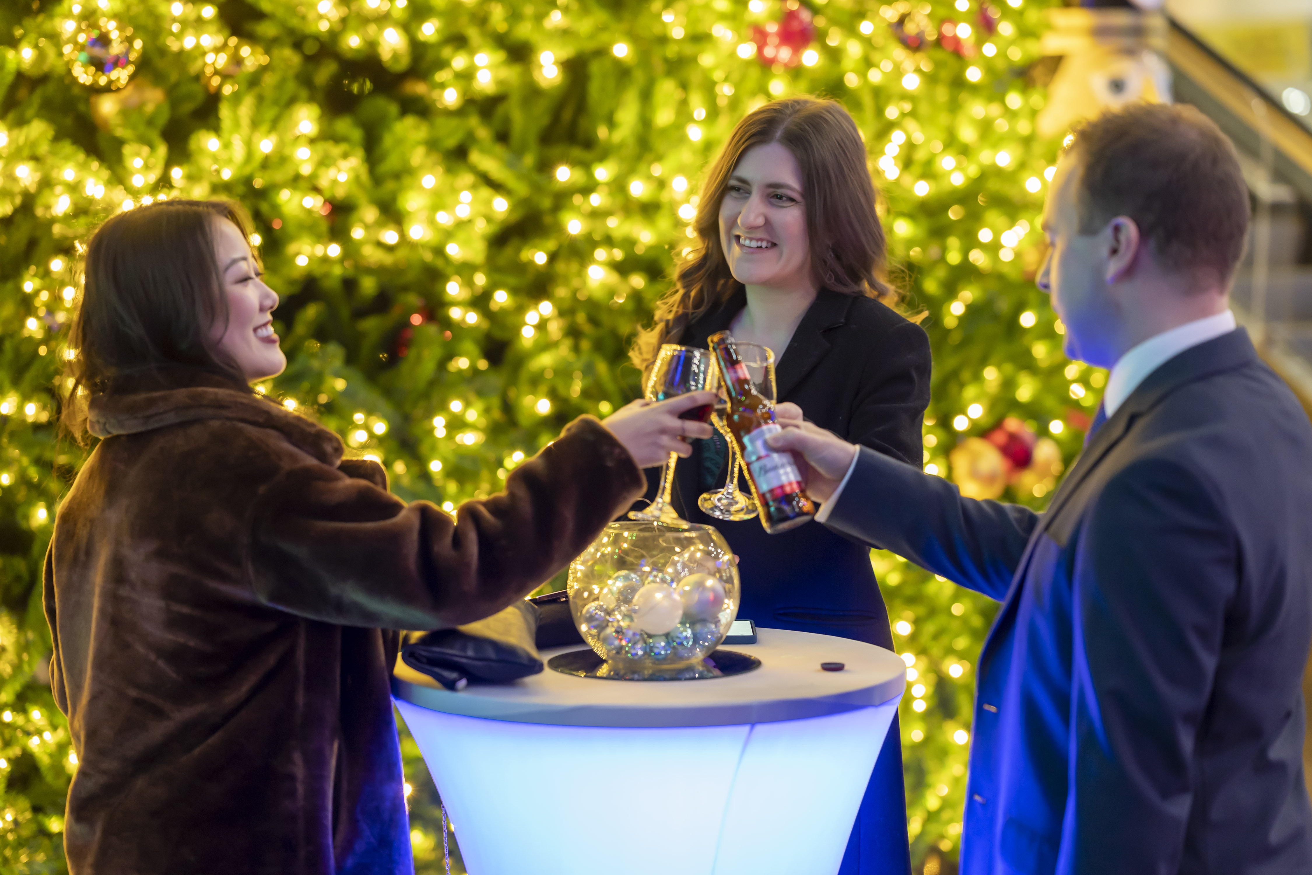 "Christmas networking event at Millennium Point with a decorated tree and festive ambiance."