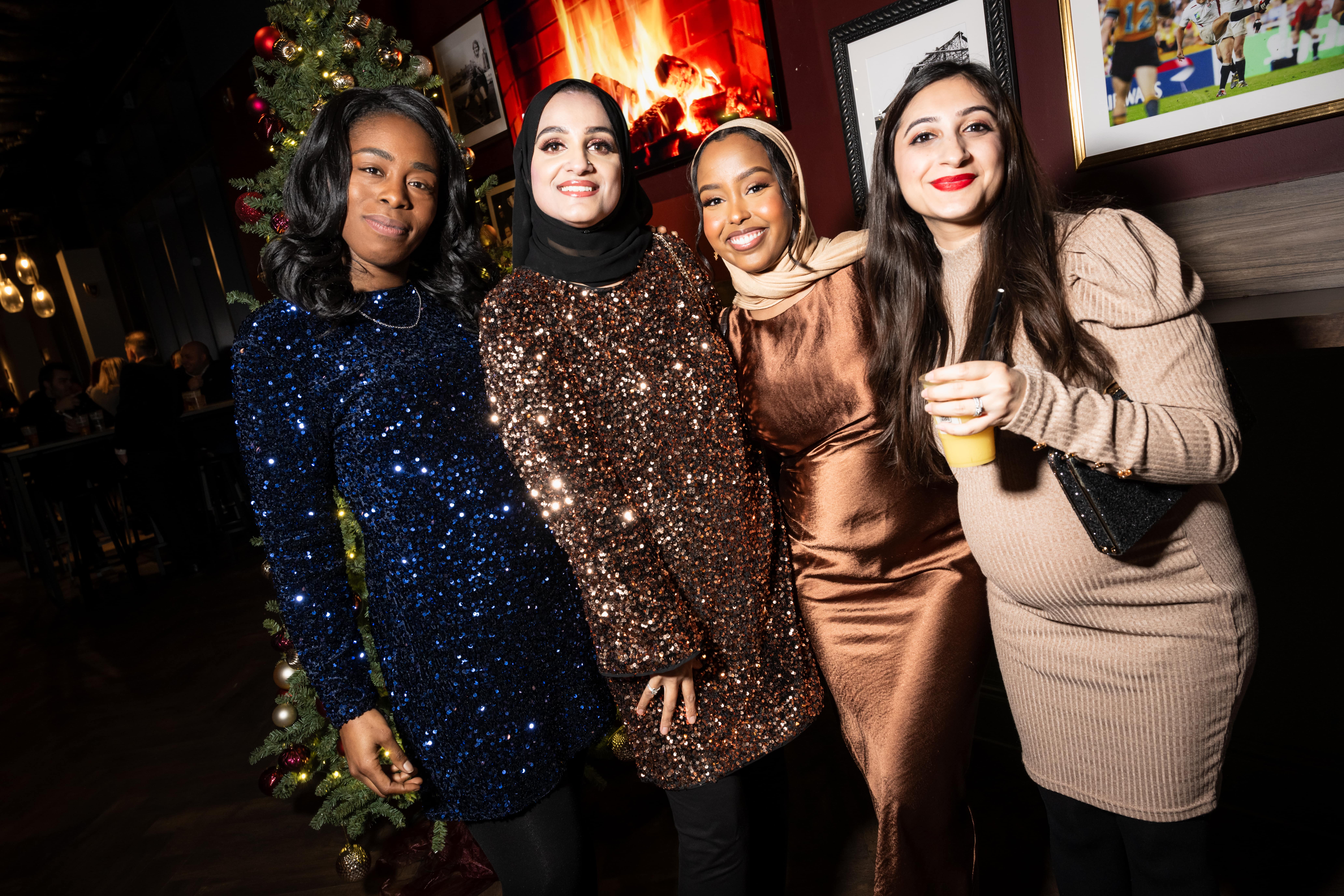 Christmas party at Allianz Stadium with women in festive attire, perfect for networking.