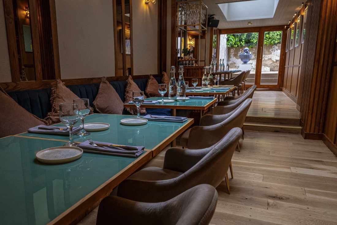 Stylish restaurant setup with elegant tables for intimate meetings and networking dinners.