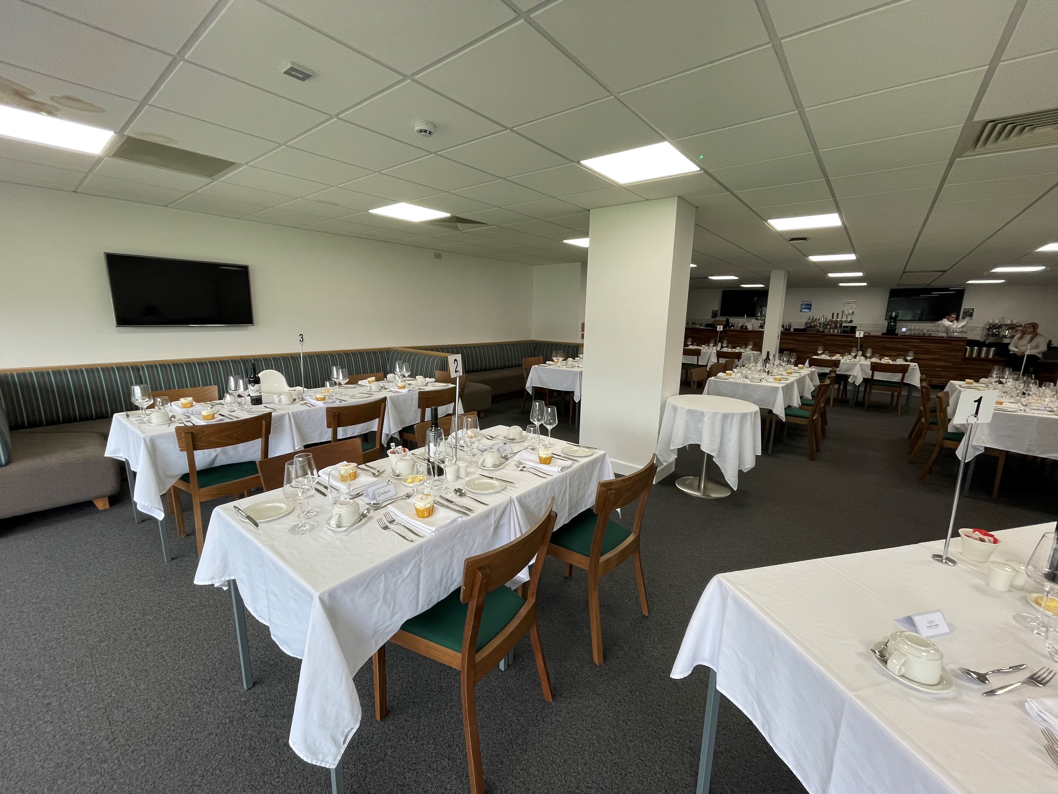 Players' Lounge at Home Park Stadium, elegant dining setup for corporate events.
