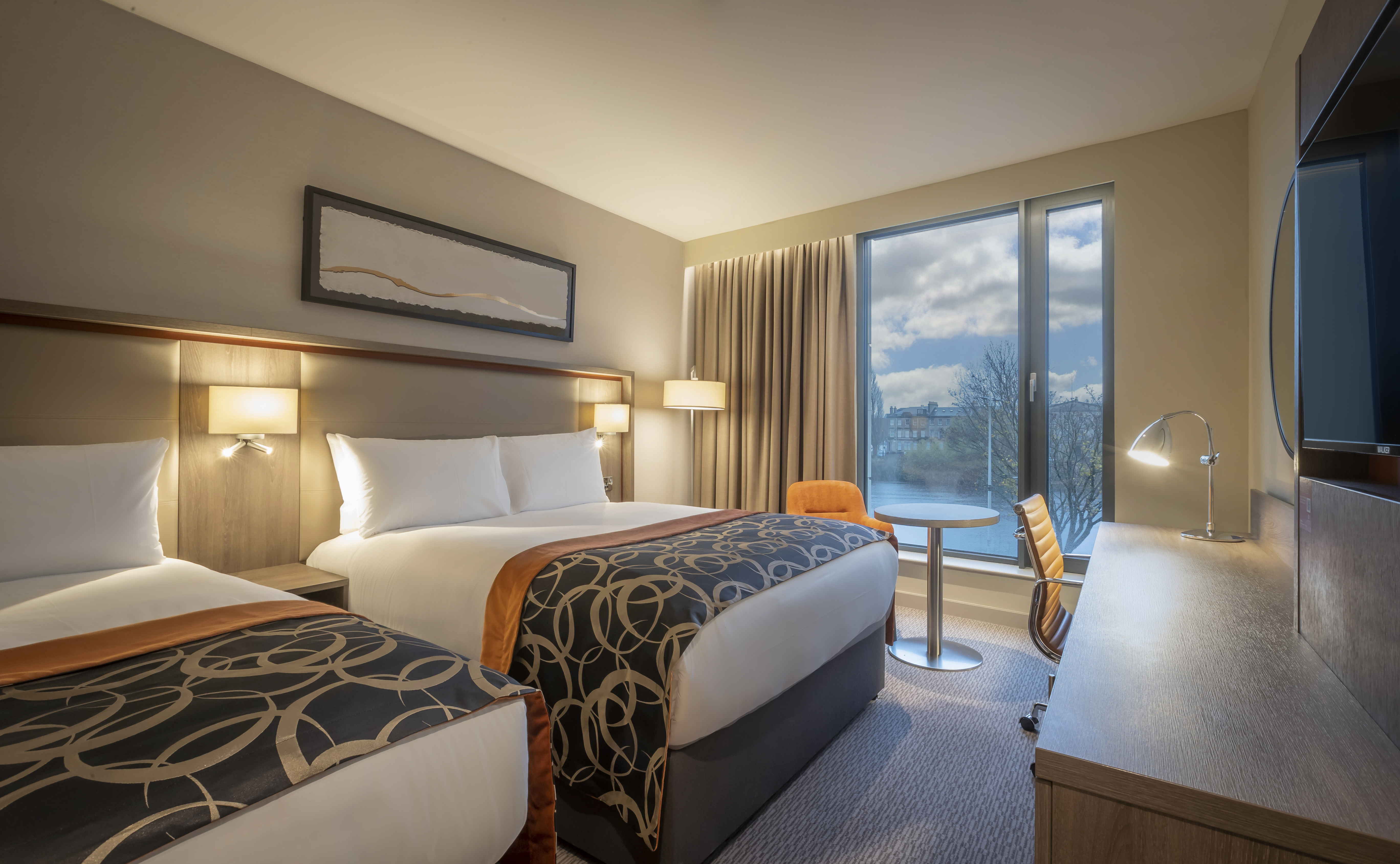 Custom House hotel room with two beds, ideal for business events and conferences.