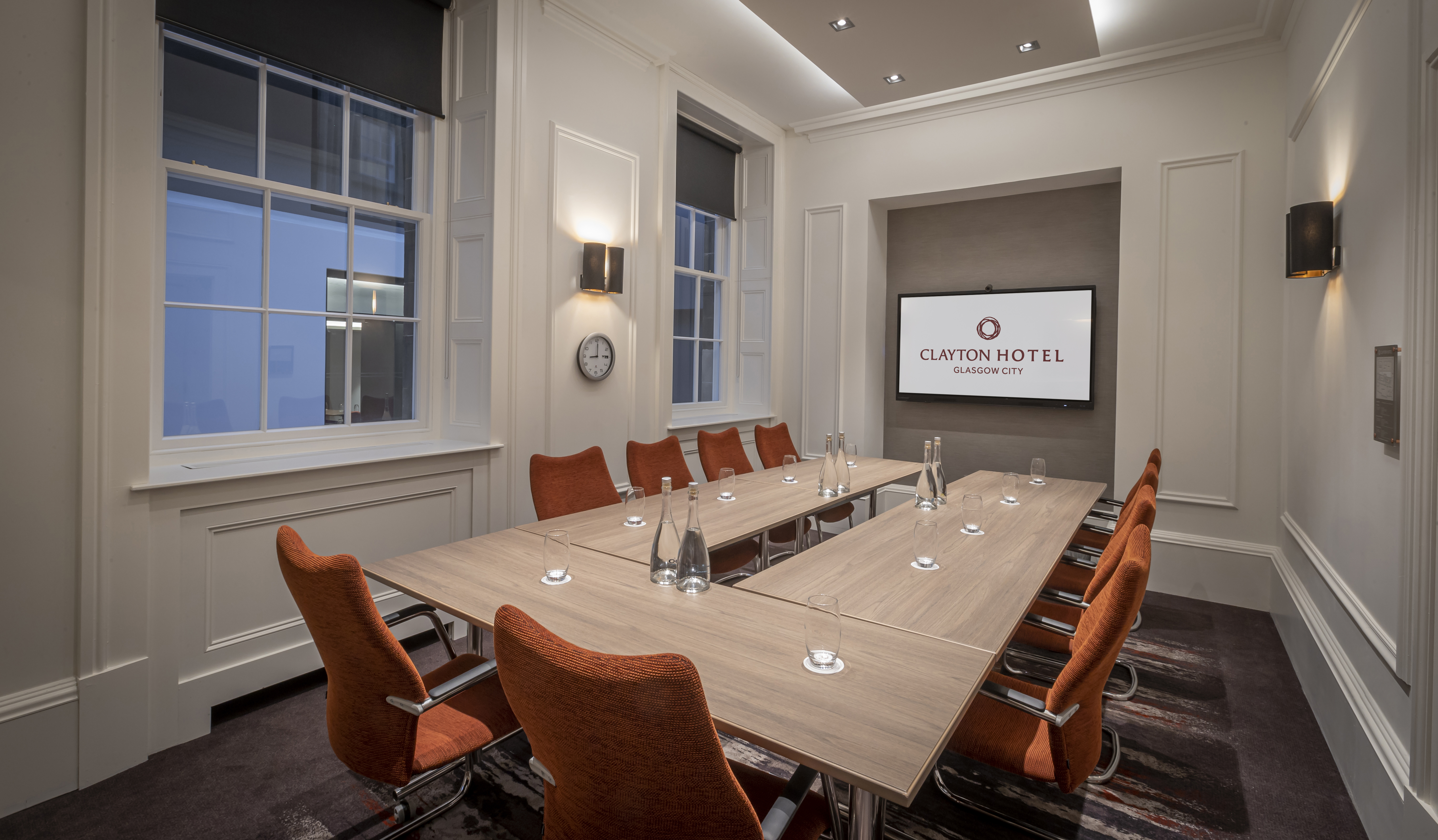 Modern meeting room at Custom House, Glasgow with sleek table and natural light.