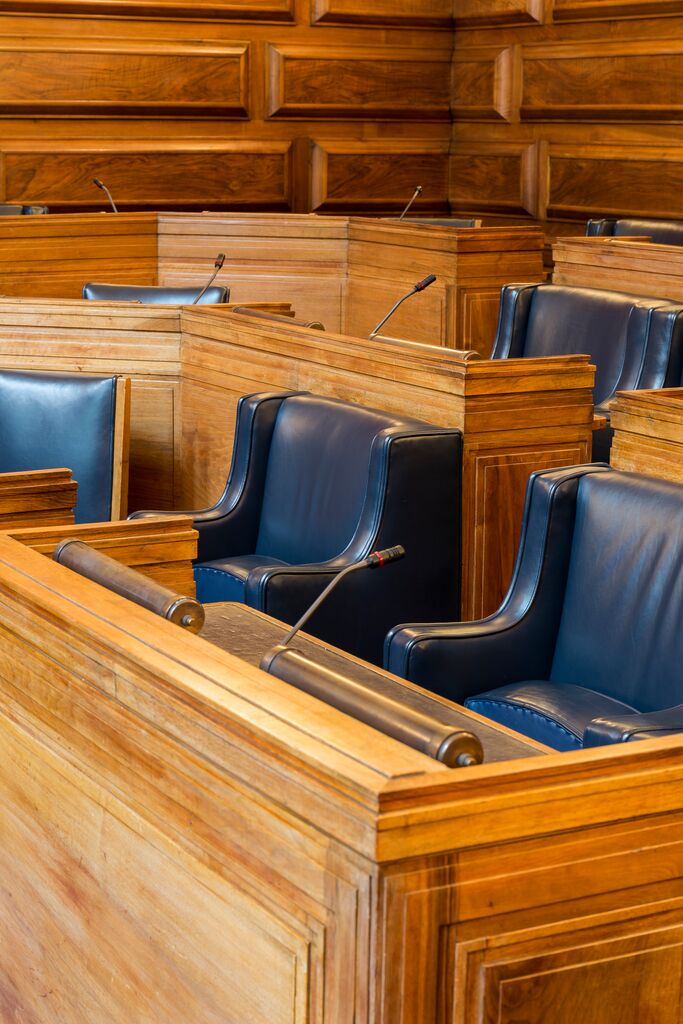 Senate Room at University of London, polished wood furnishings for formal meetings.