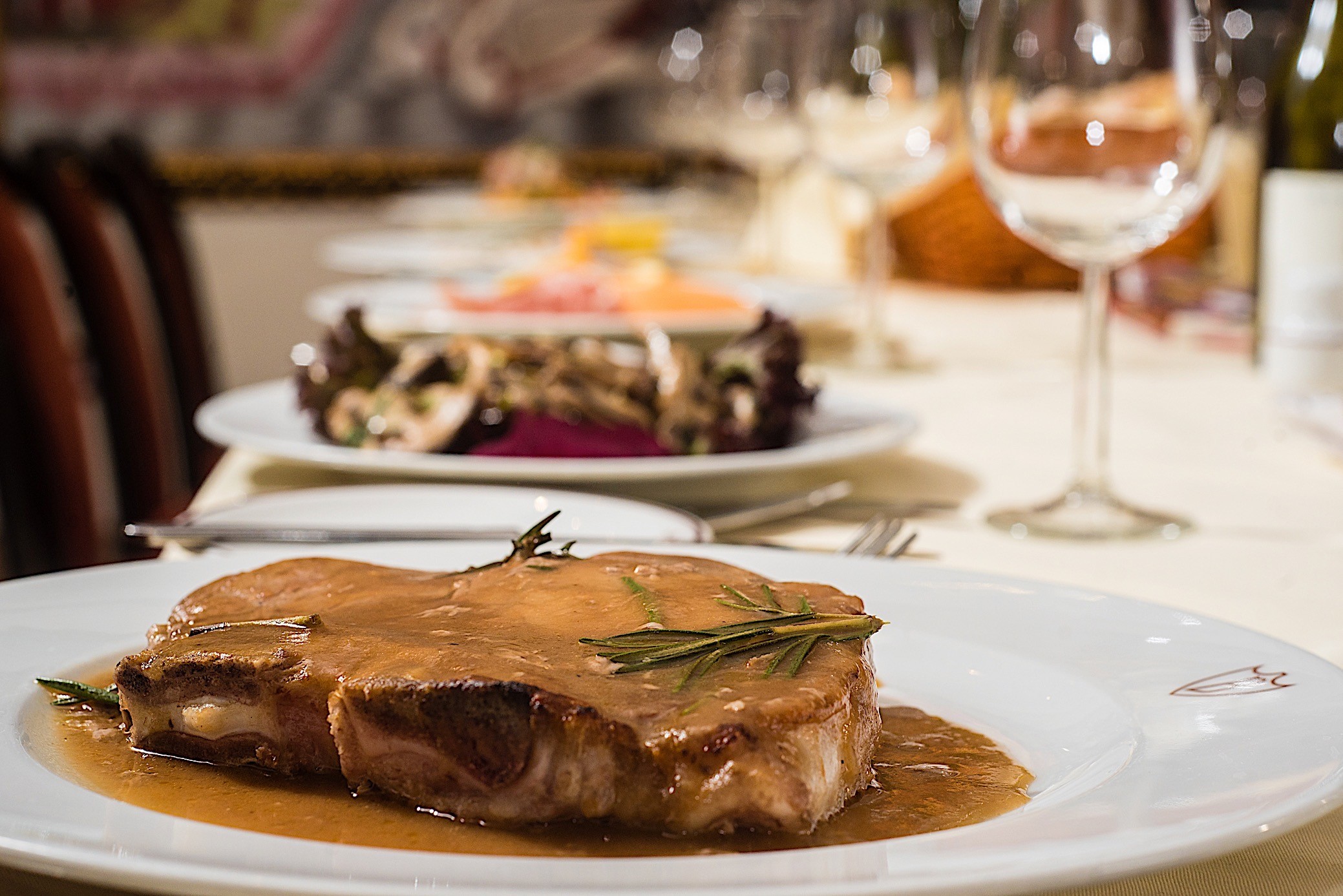 Elegant plated dish in Venetian Room, Bolton's Restaurant for upscale dining events.