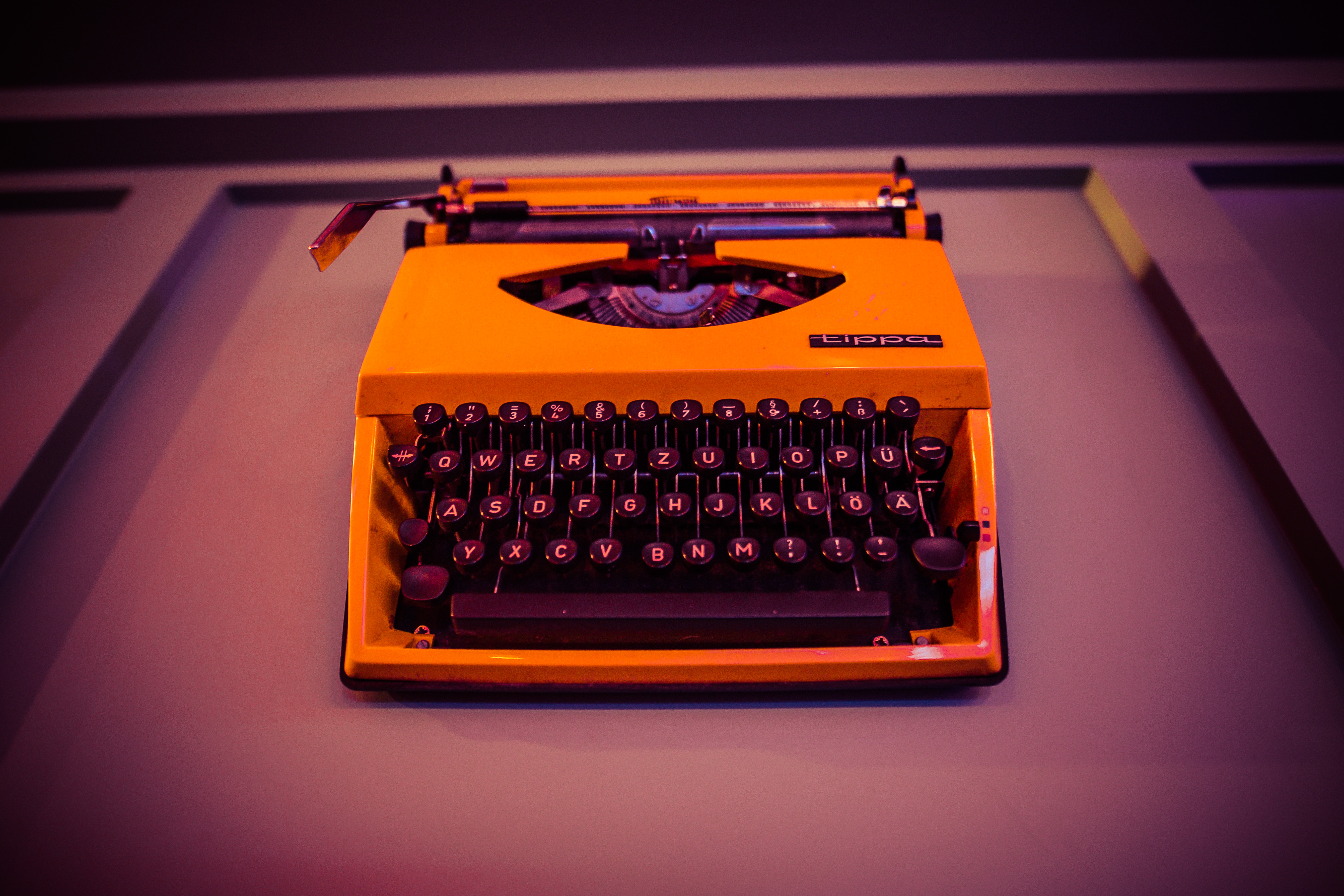 Vibrant yellow typewriter at Simmons|Leicester Square for creative event hire.