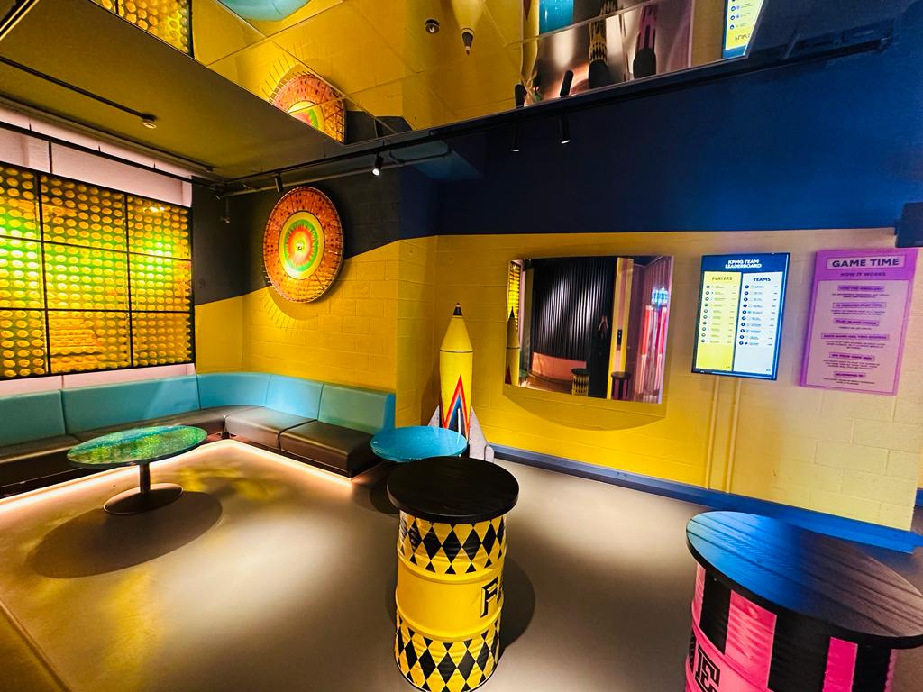Vibrant Holy Duck Lounge with oversized crayon, perfect for team-building events.