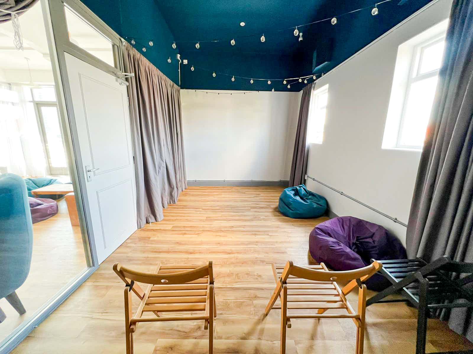 Cinema Room in Birmingham Selina with bean bags for casual meetings and brainstorming.