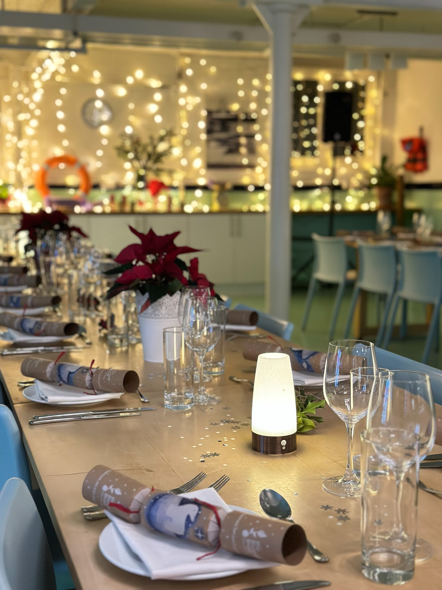 Elegant dining table with poinsettias at Wallacespace St Pancras for corporate events.
