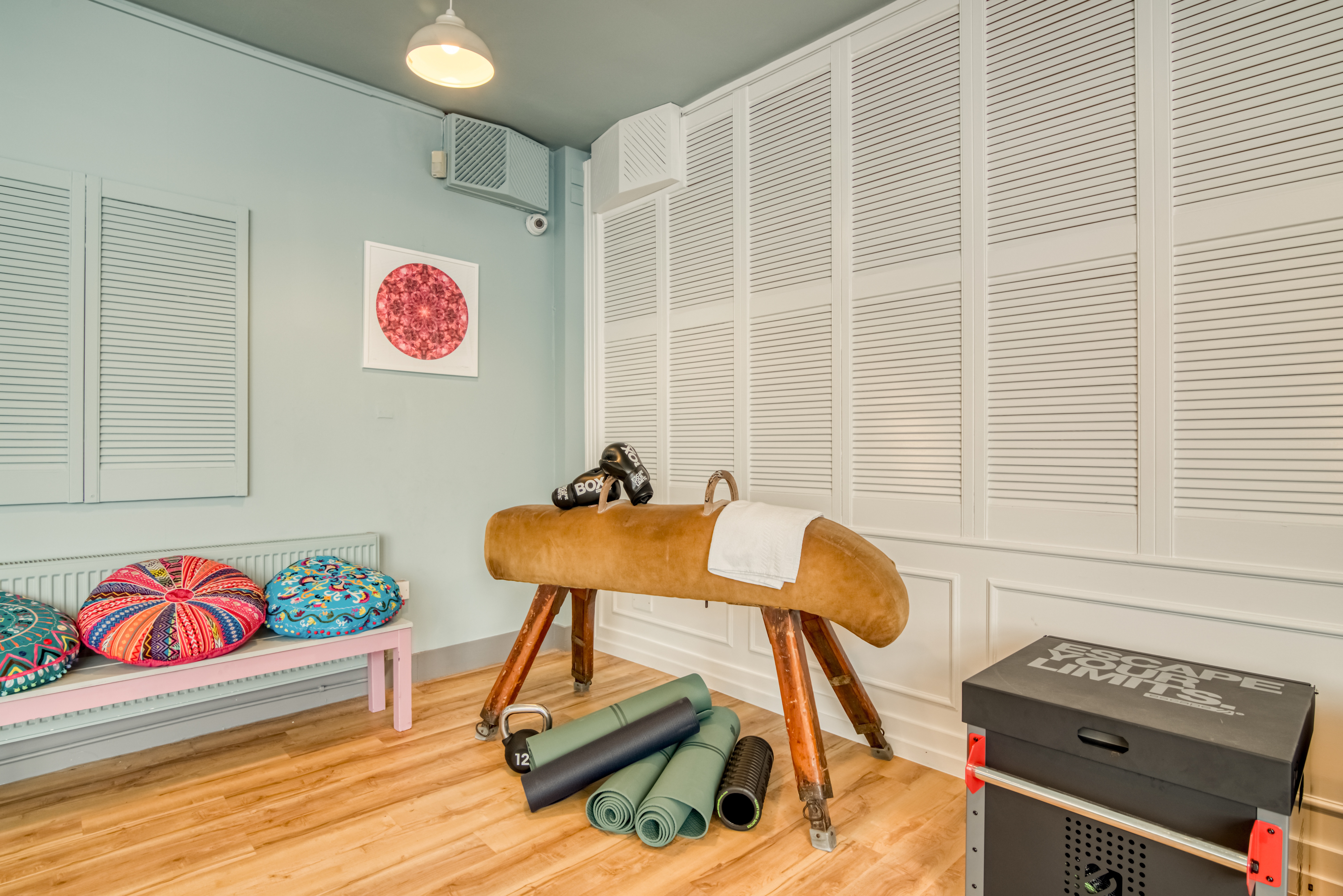 Wellness Room in Birmingham Selina with yoga mats for fitness classes and workshops.