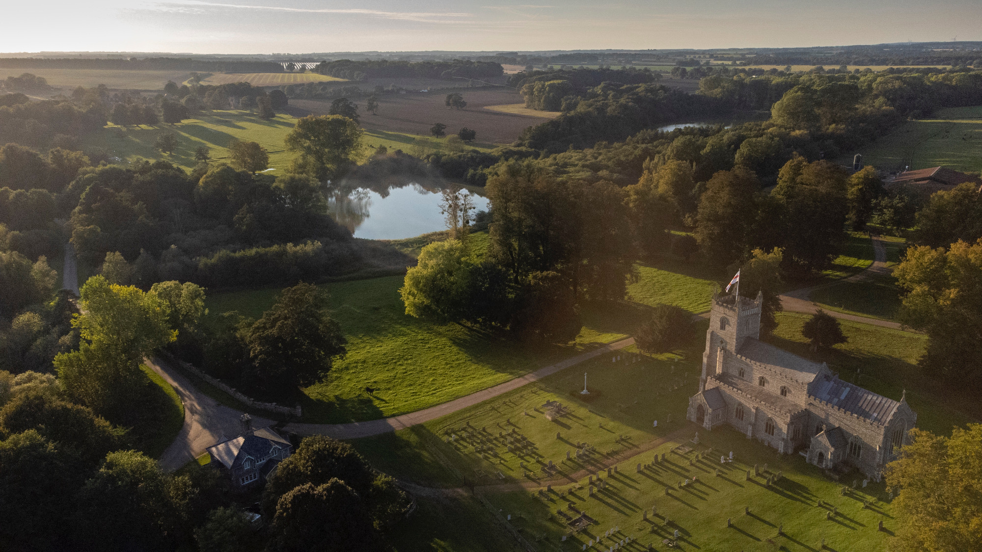 Raynham Park venue with charming church, ideal for weddings and outdoor events.