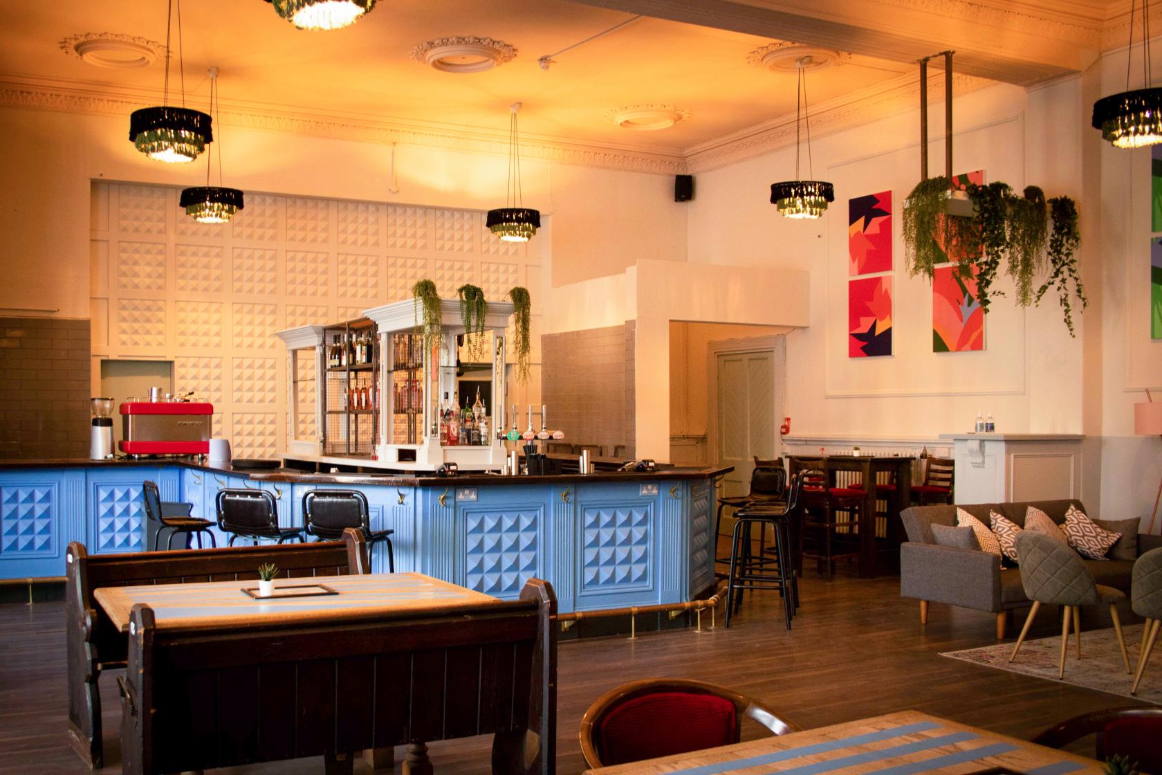 Stylish event space in Liverpool with modern bar and vibrant decor for gatherings.