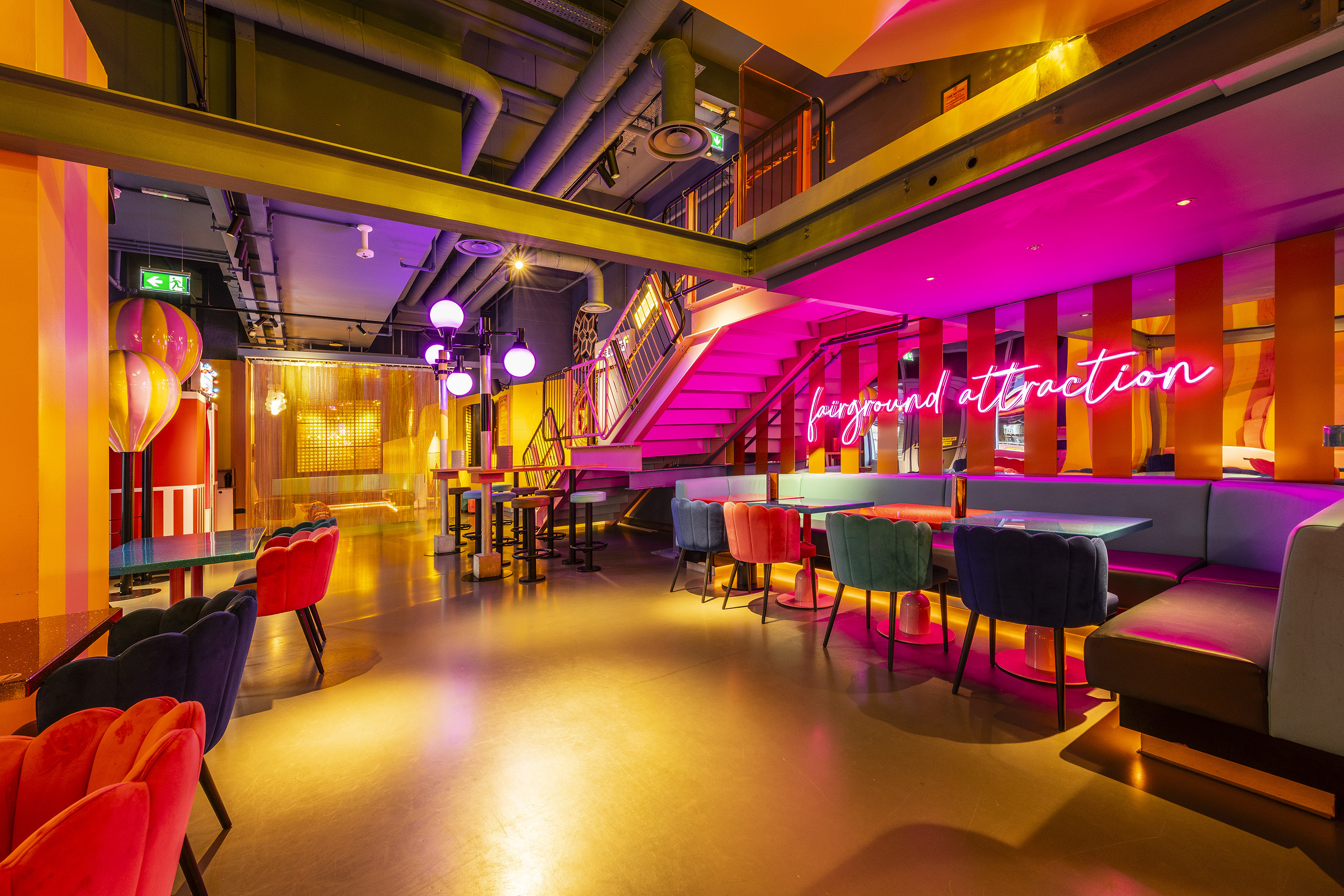 Vibrant Carousel event space with neon decor, ideal for social gatherings and networking.