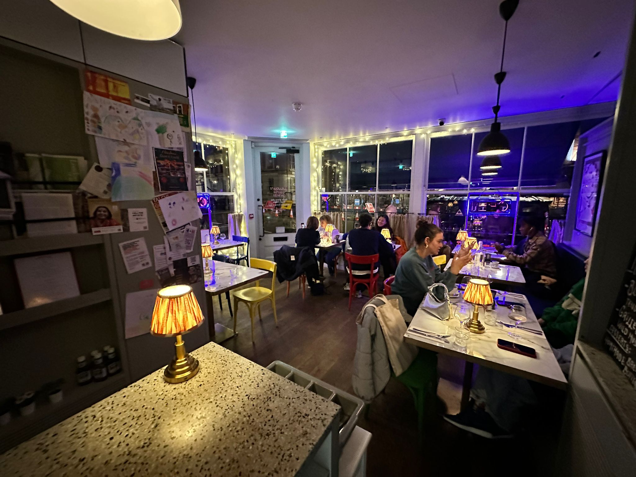 Cozy Sam's Cafe venue with warm lighting, perfect for intimate gatherings and networking events.