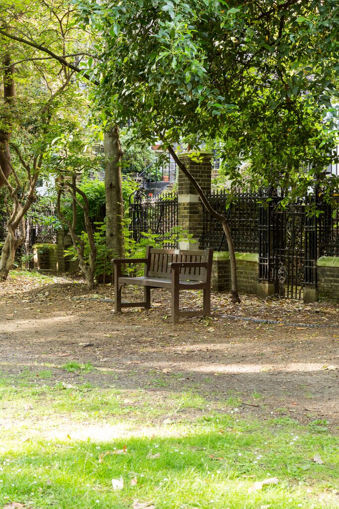 Sunken Gardens at University of London: serene outdoor bench for events and networking.