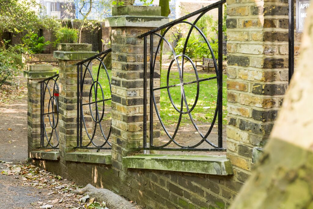 Elegant wrought iron fence at Sunken Gardens, ideal for outdoor events and gatherings.