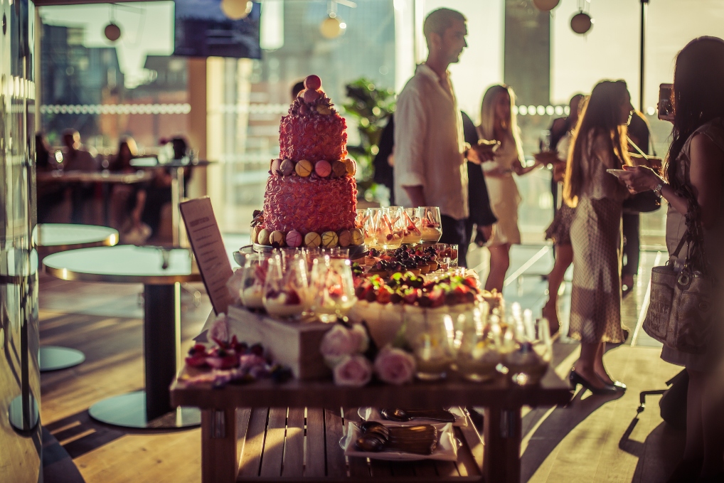 Elegant dessert table with multi-tiered cake in Rose Court Events' Private Dining Room.