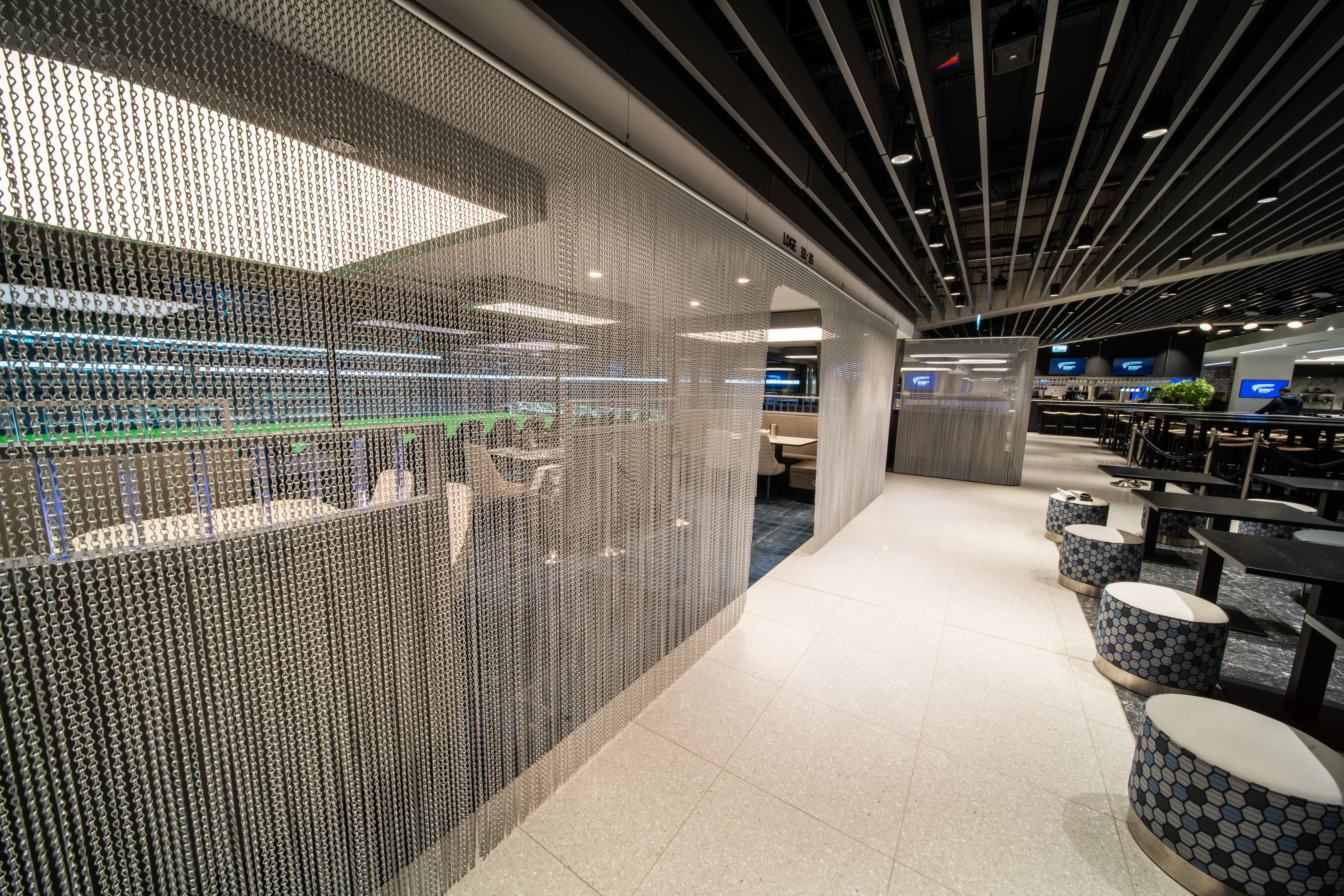 Modern event space at Tottenham Hotspur Stadium with unique seating and sleek design.