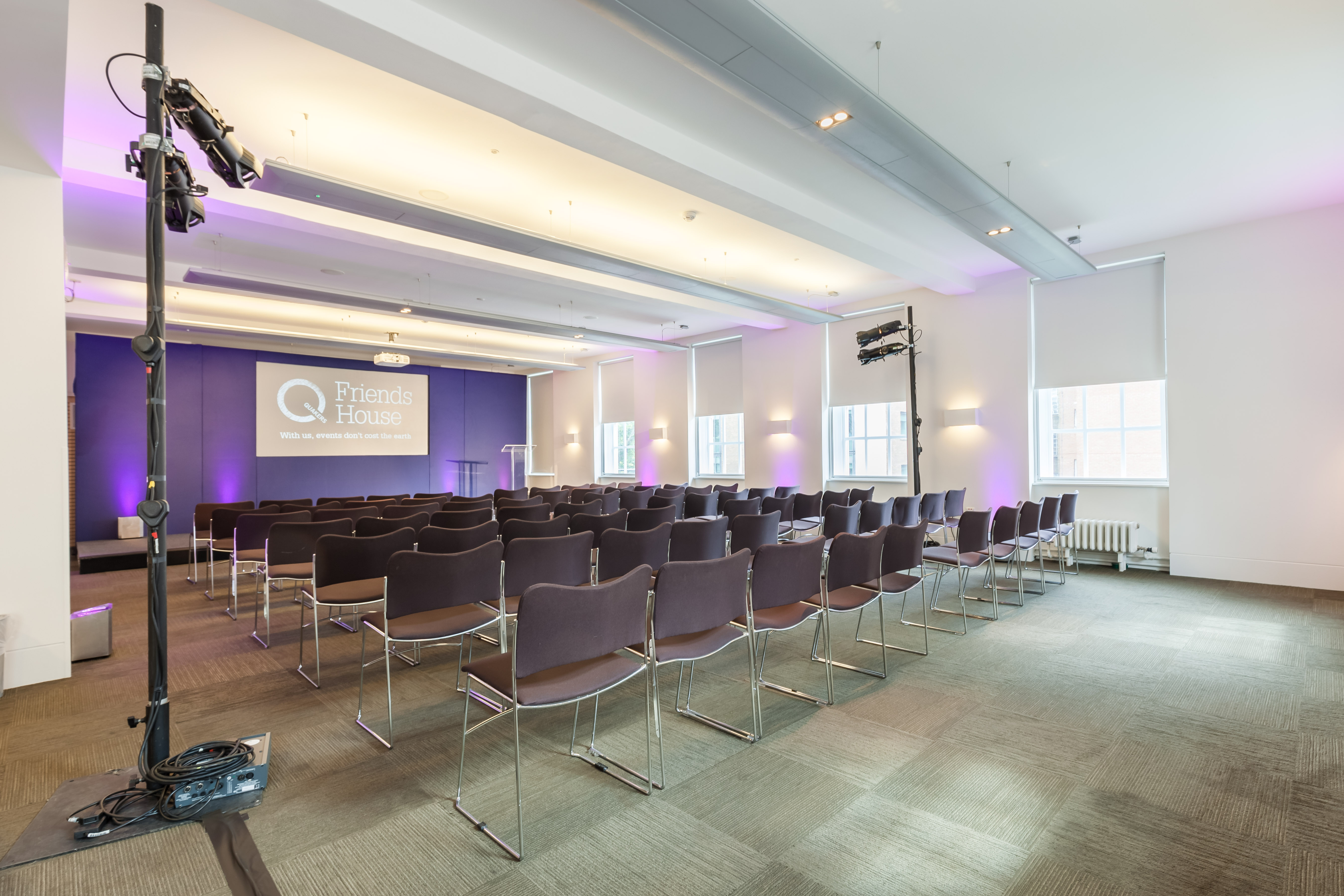 Event space at Friends House with purple lighting, ideal for conferences and meetings.