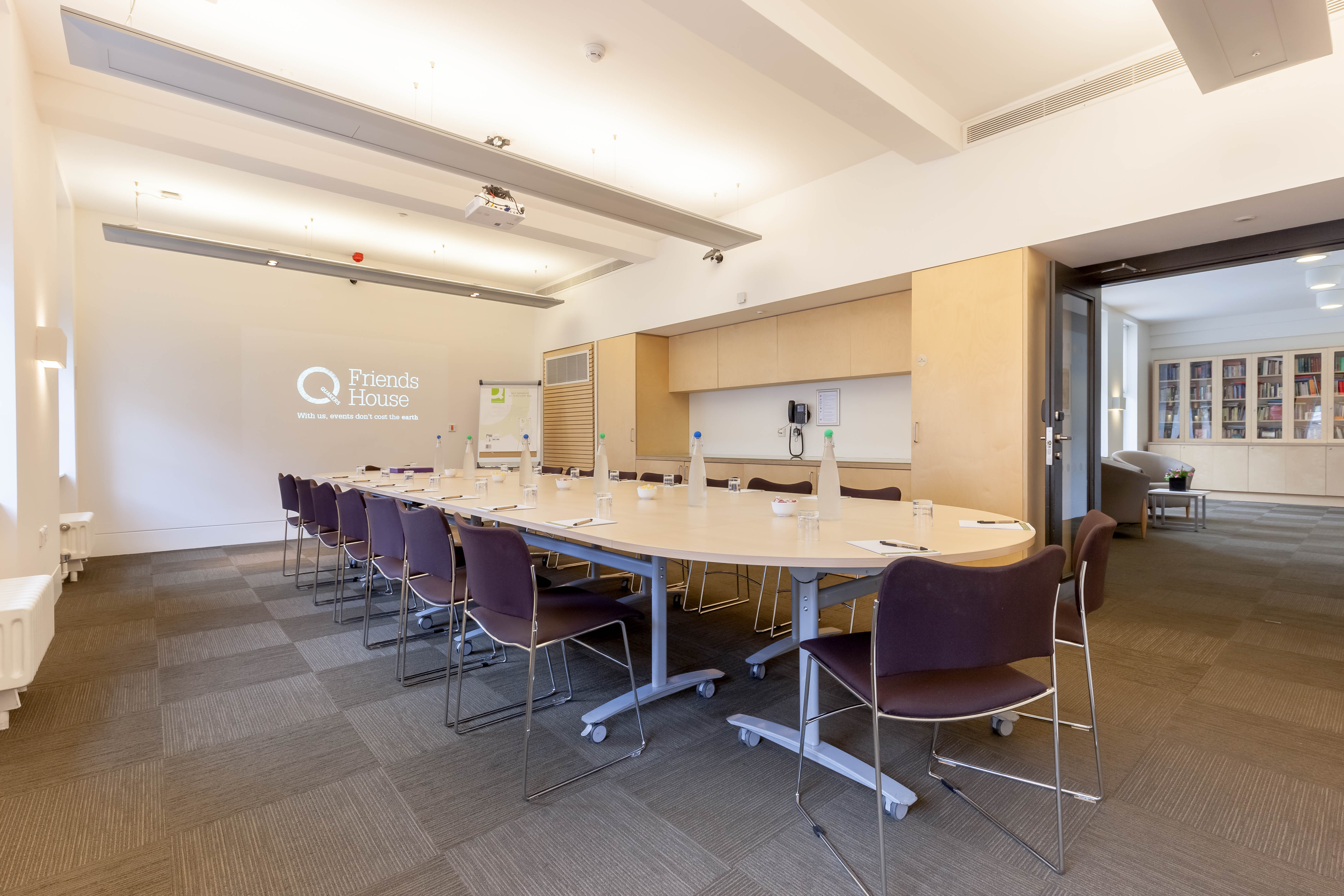 Margaret Fell in a bright, modern meeting room for corporate events and workshops.