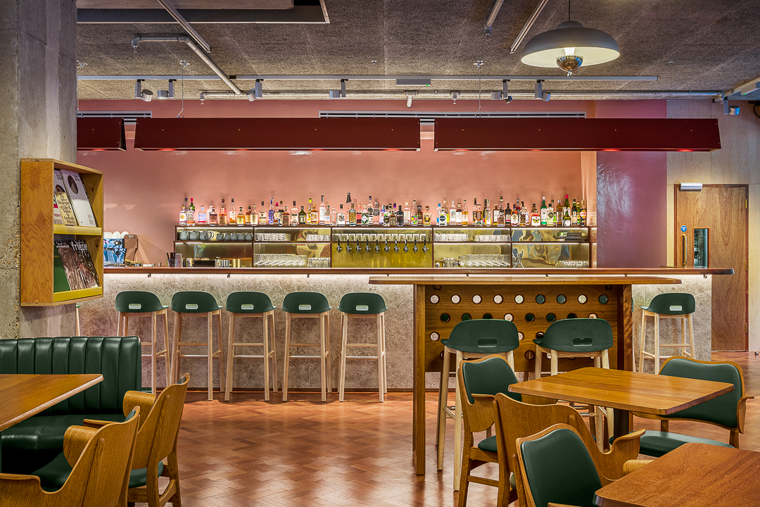 Stylish bar area at Toklas Restaurant, ideal for networking events and casual meetings.