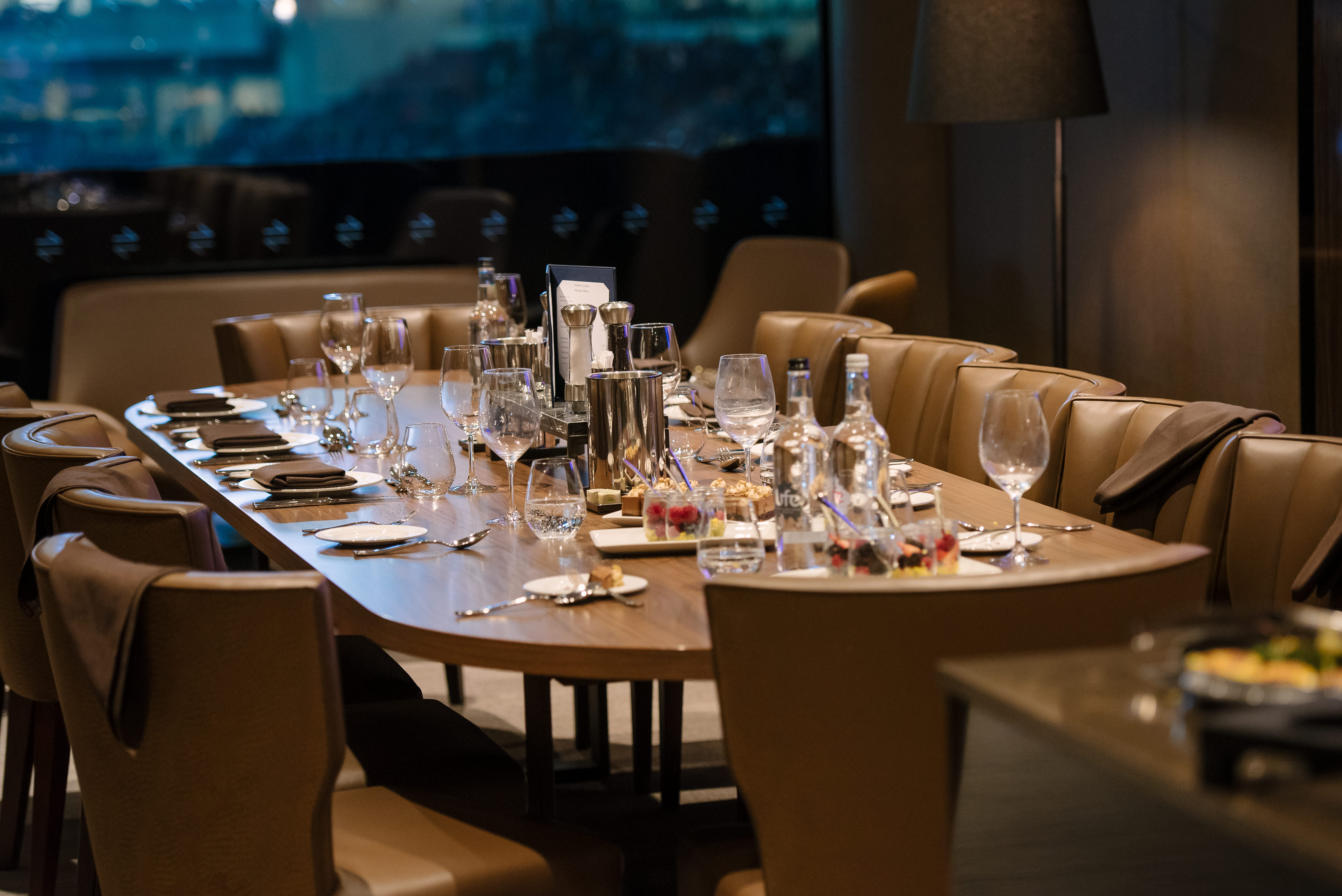 Elegant dining table setup for upscale corporate events at Tottenham Hotspur Stadium.