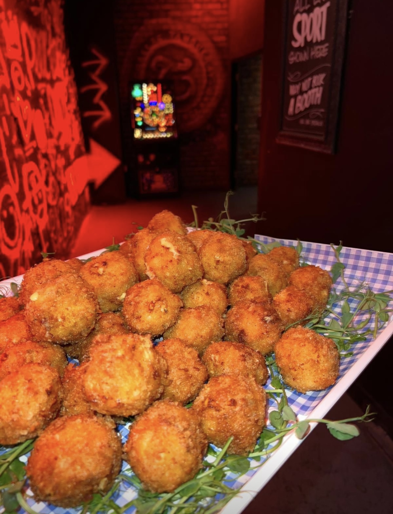 Vibrant platter of crispy appetizers at Main Bar, ideal for networking events and gatherings.