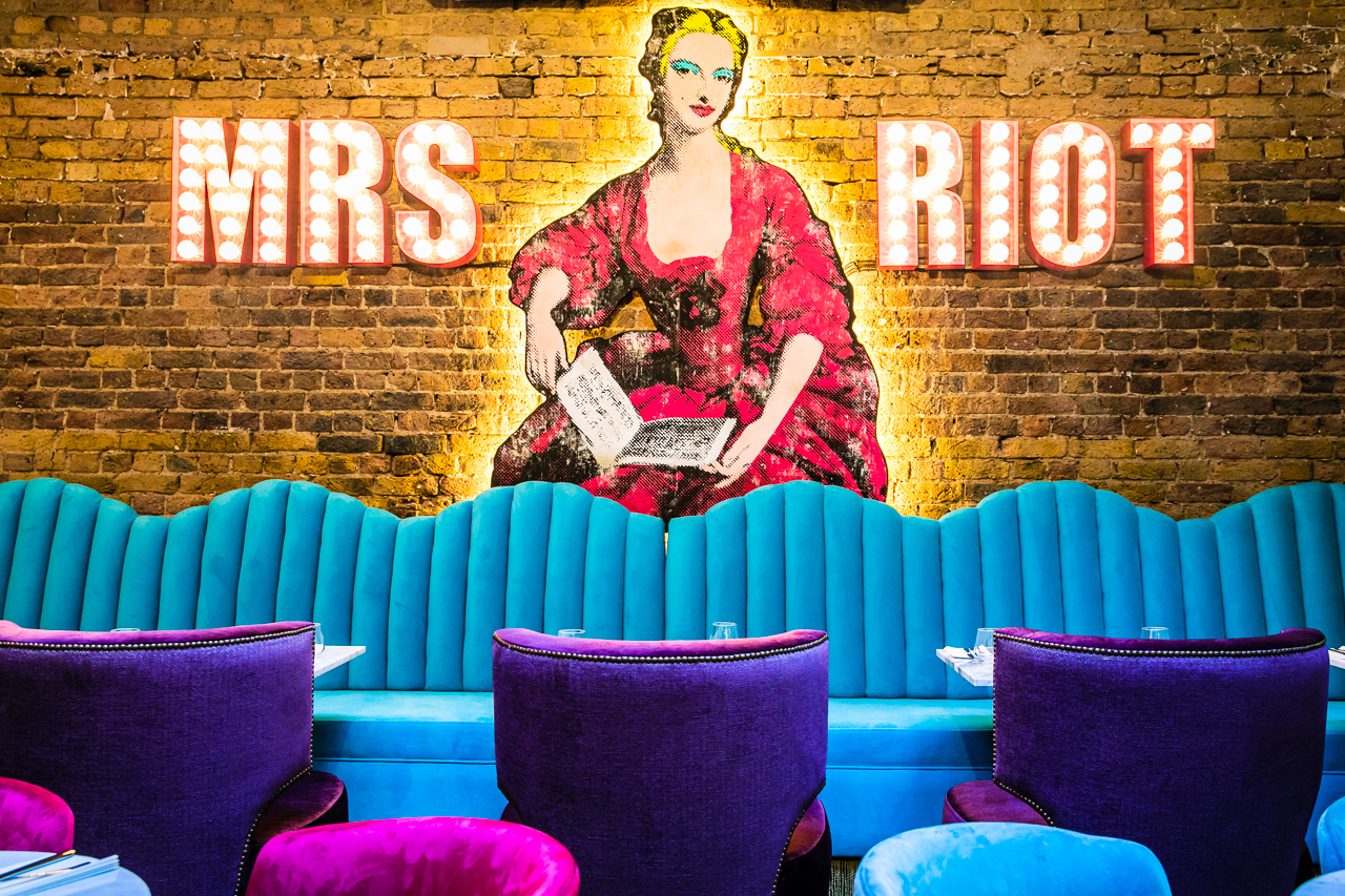 Vibrant venue with bold mural for creative meetings and brainstorming events.